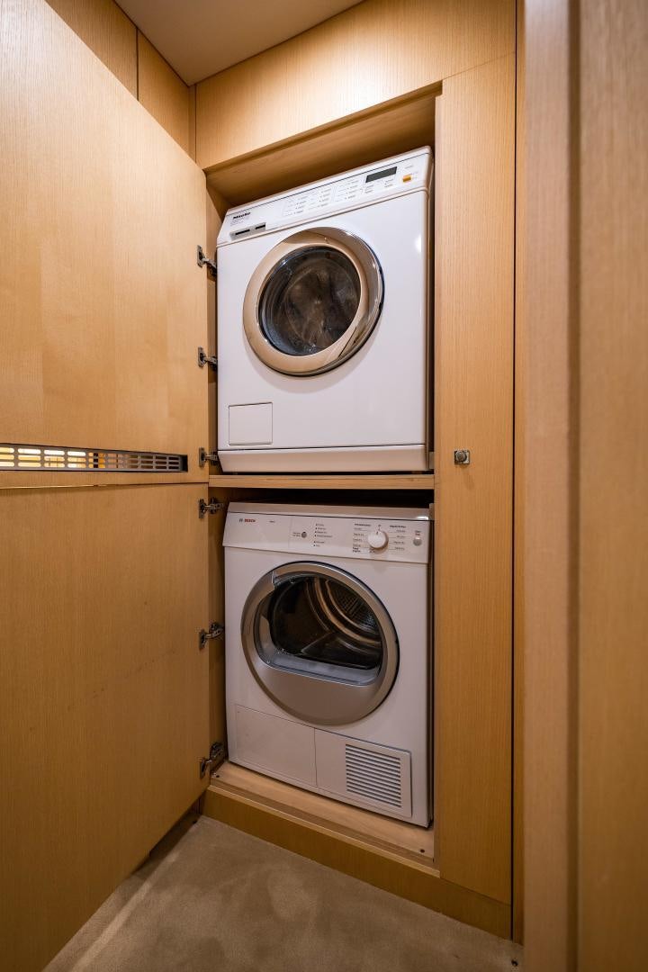 a washer and dryer in a room aboard THE KING Yacht for Sale