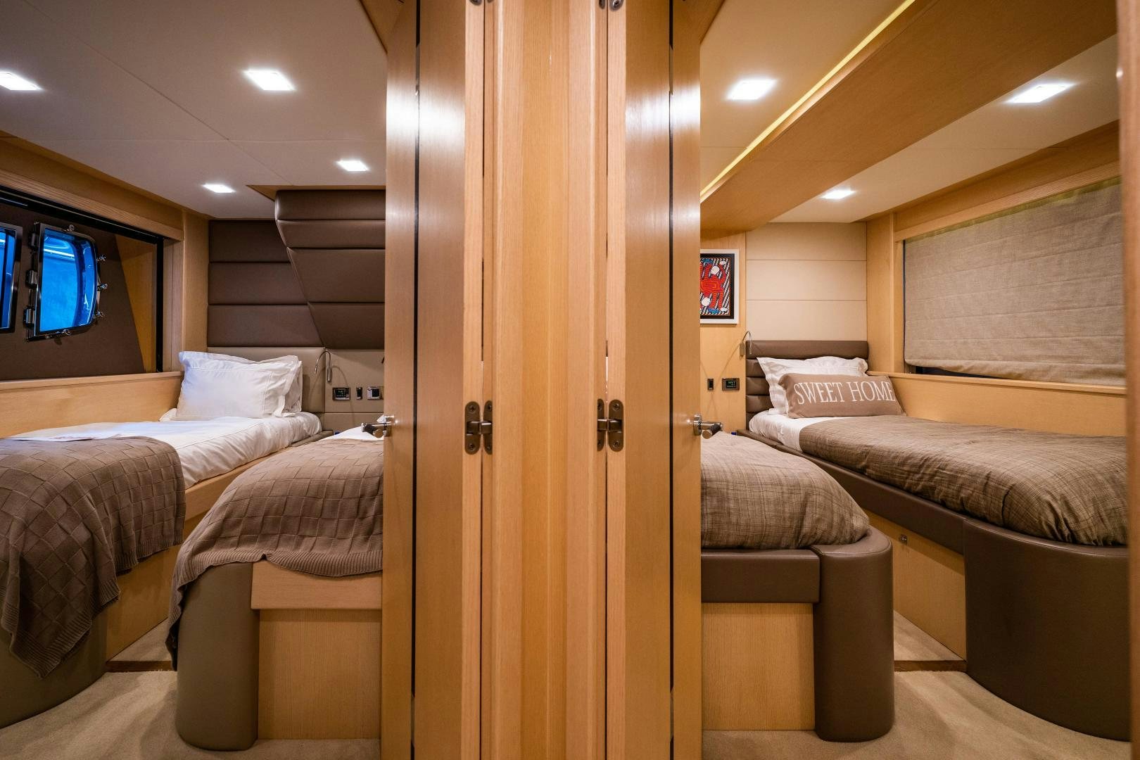 a room with a bed and a wood door aboard THE KING Yacht for Sale