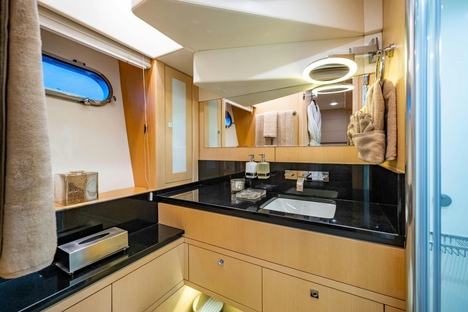 a bathroom with a sink and a mirror aboard THE KING Yacht for Sale