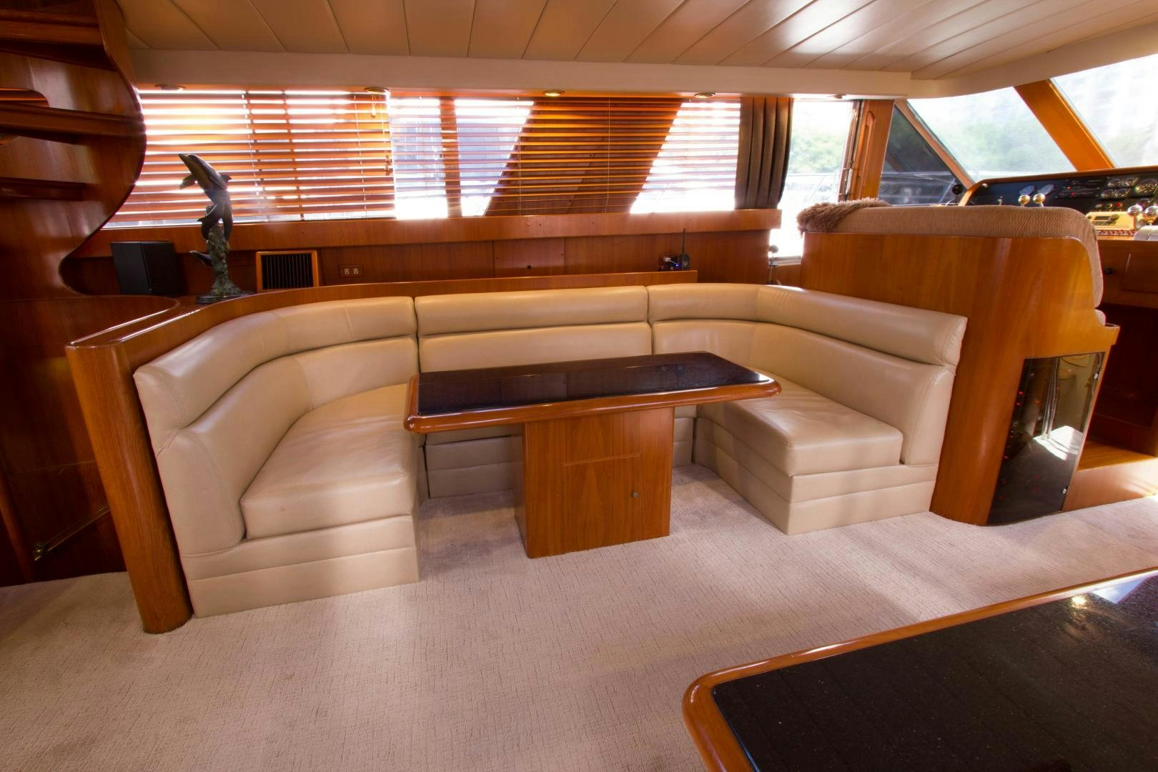 a room with couches and a table aboard Seaquest Yacht for Sale