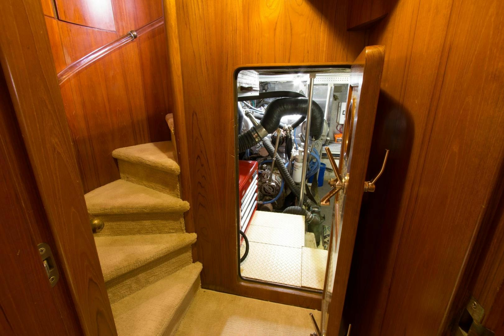 a dog sitting in a dog door aboard Seaquest Yacht for Sale