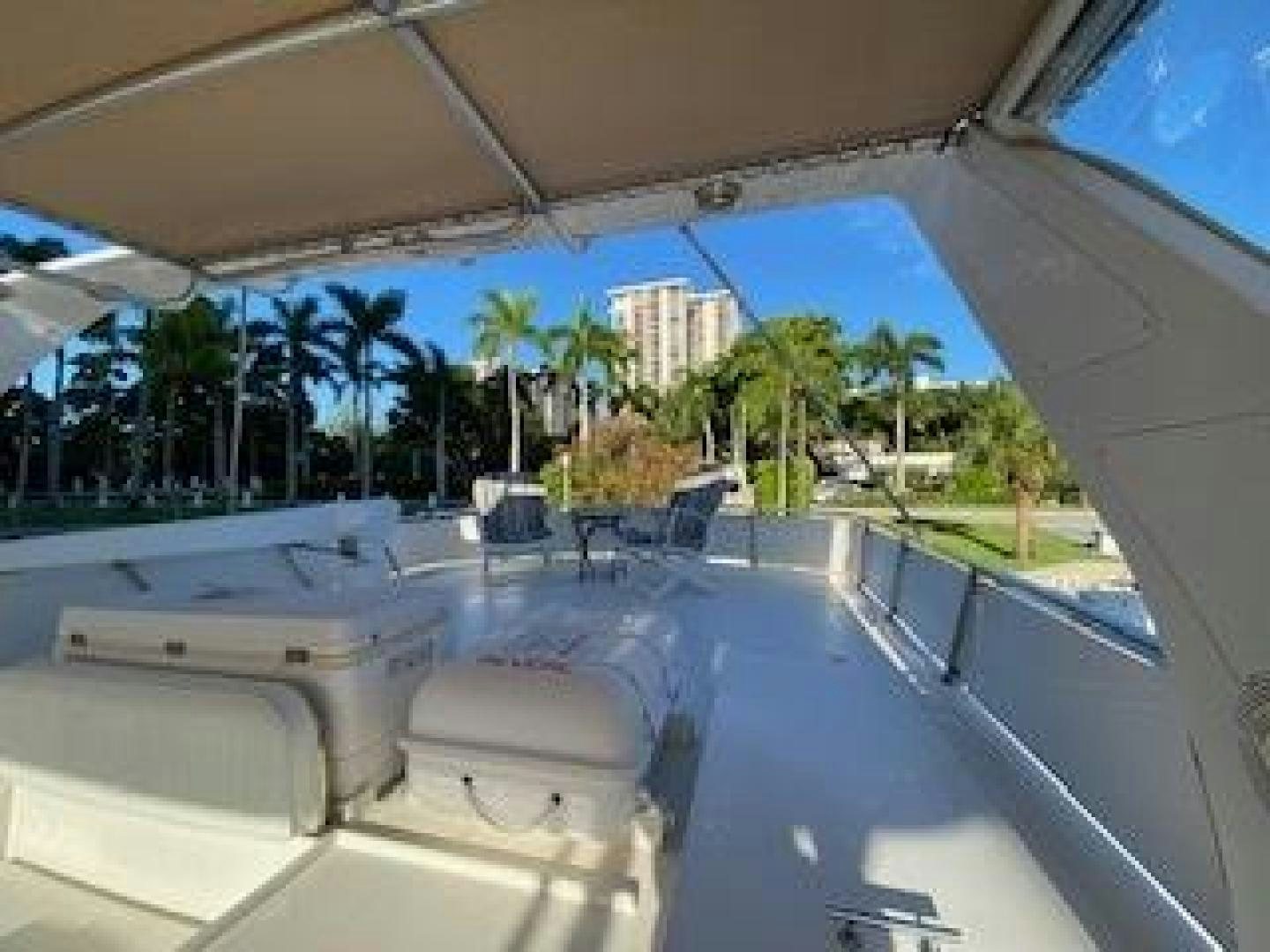 a pool with a deck and trees aboard Seaquest Yacht for Sale