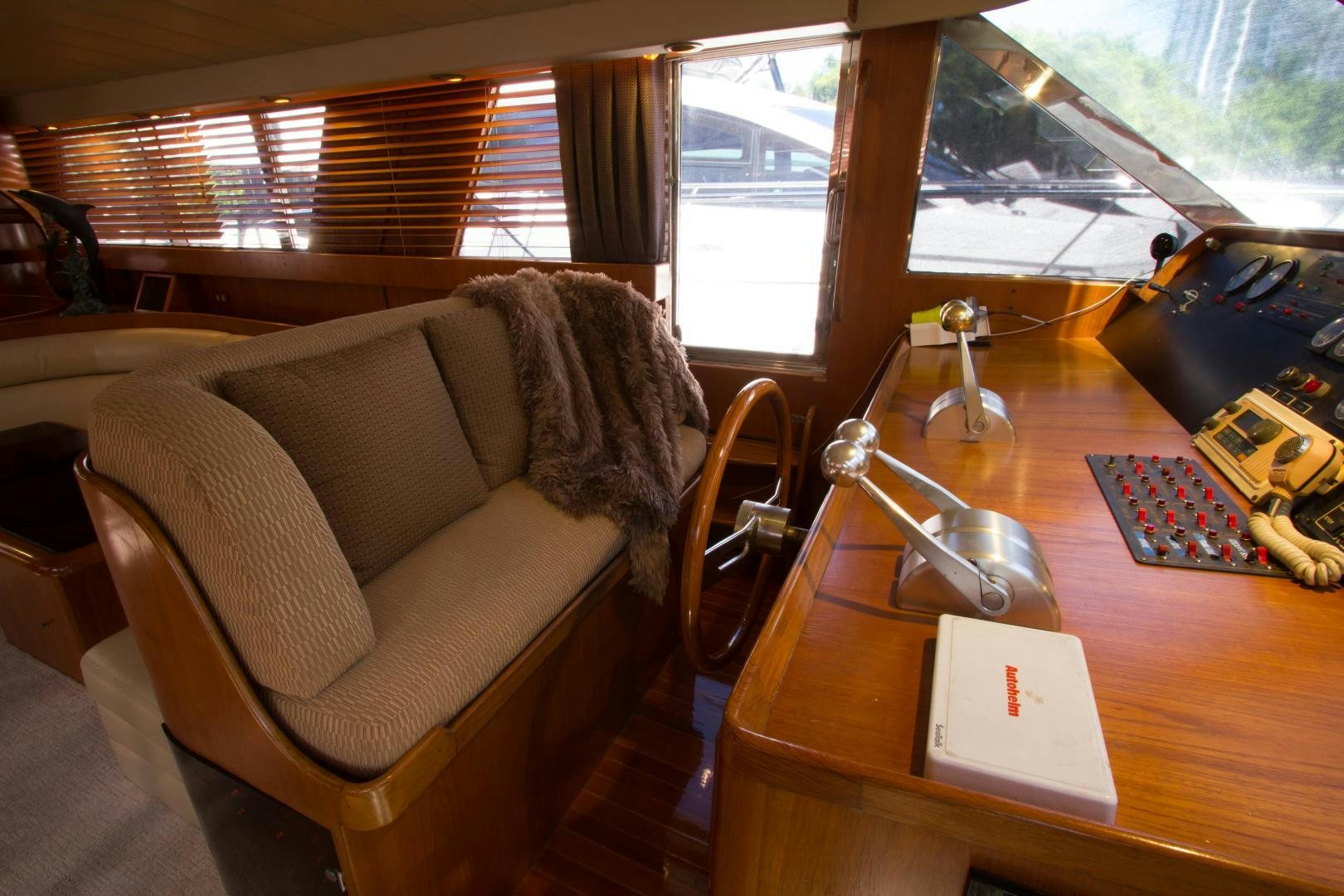 a living room with a couch and a table aboard Seaquest Yacht for Sale