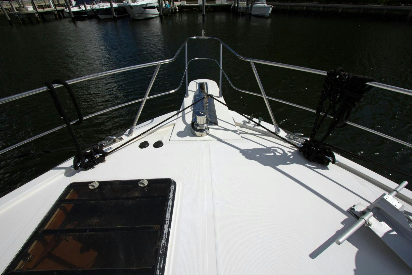 a boat with a person standing on the deck aboard Seaquest Yacht for Sale