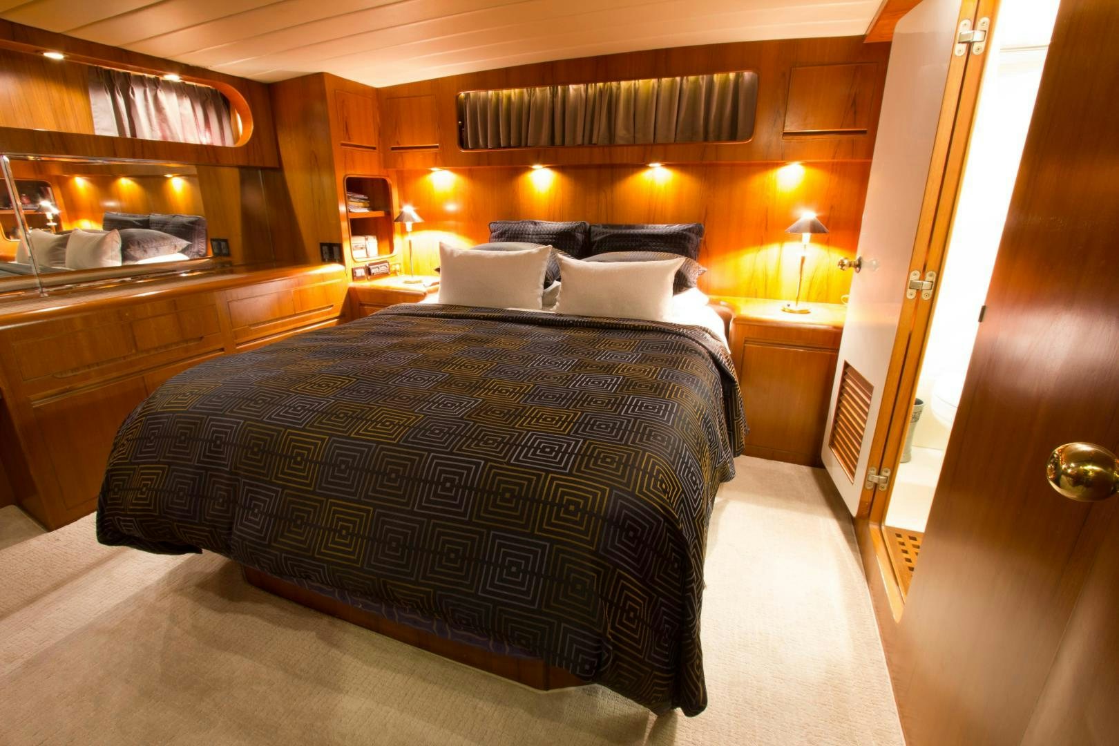 a bed in a hotel room aboard Seaquest Yacht for Sale