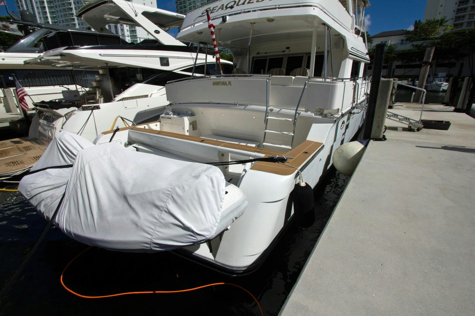 a boat with a tarp on it aboard Seaquest Yacht for Sale