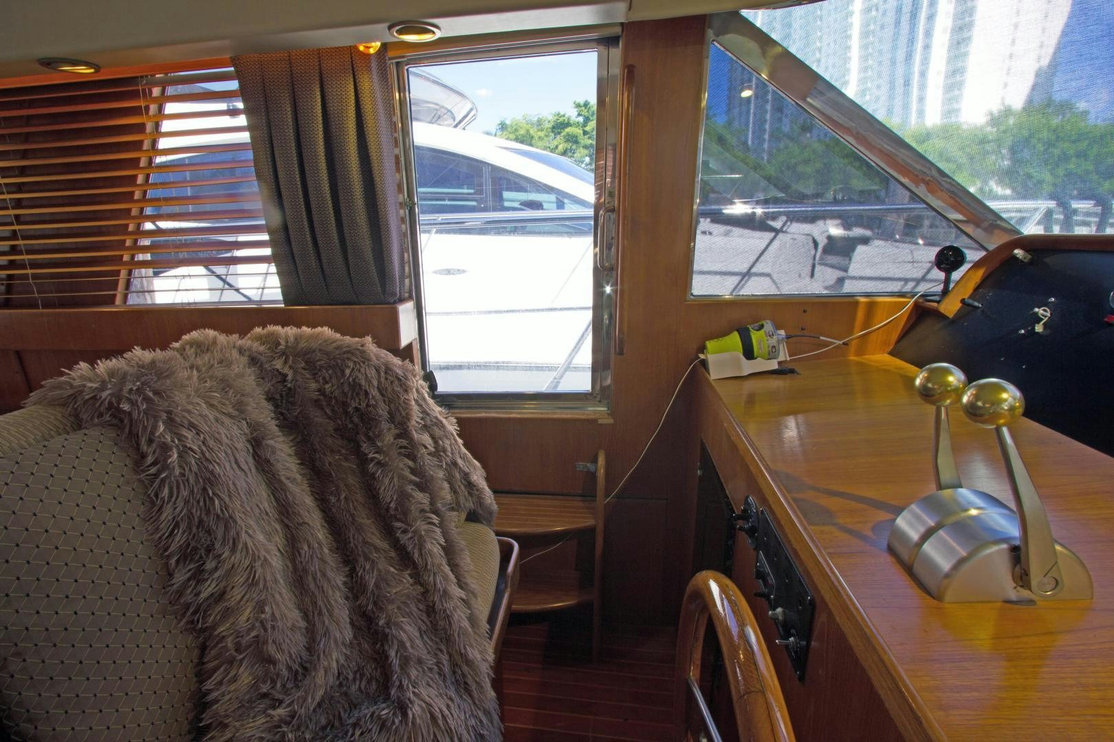 a cat looking out a window aboard Seaquest Yacht for Sale