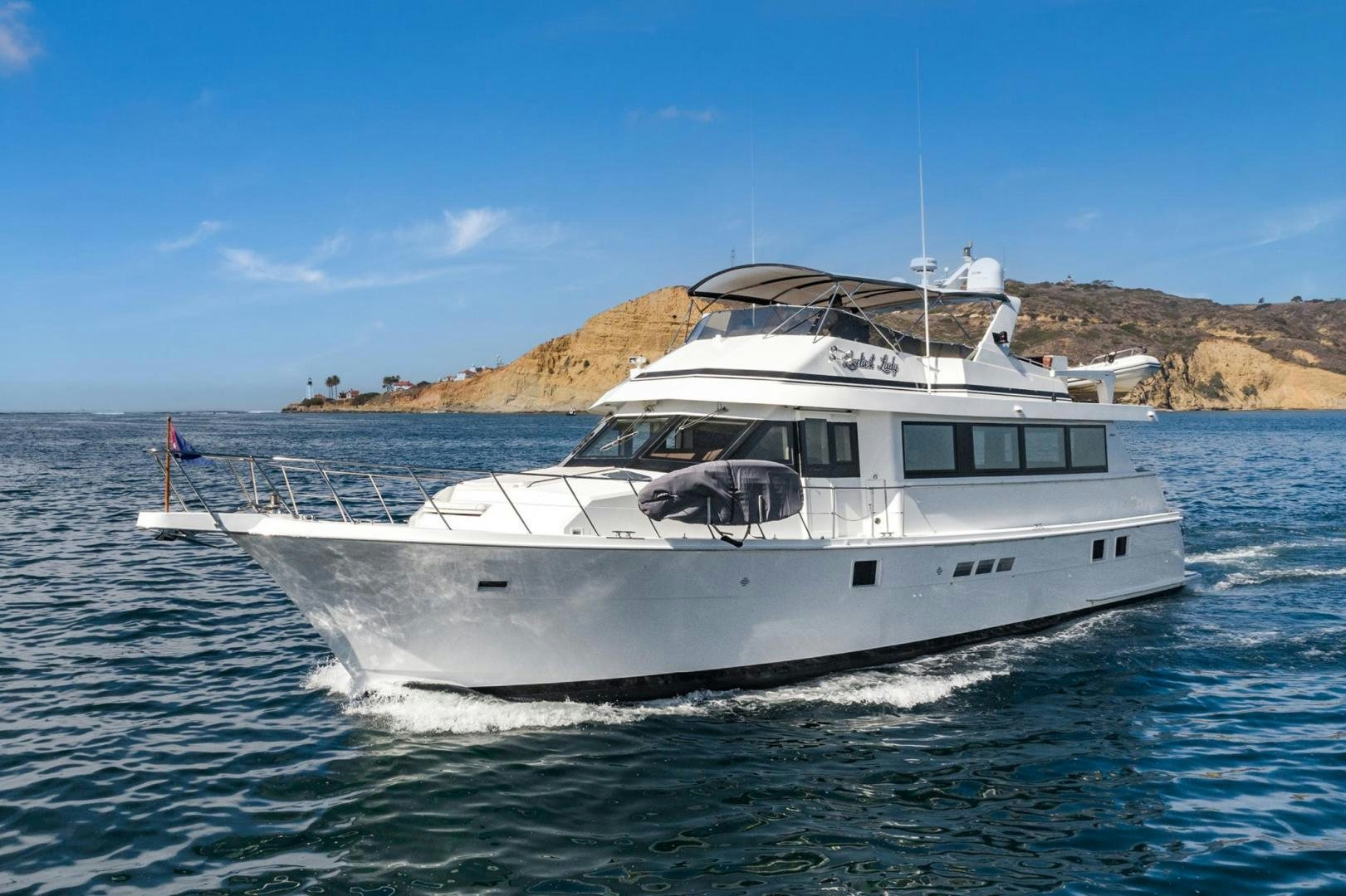 a white boat in the water aboard LOVELIEST LADY Yacht for Sale