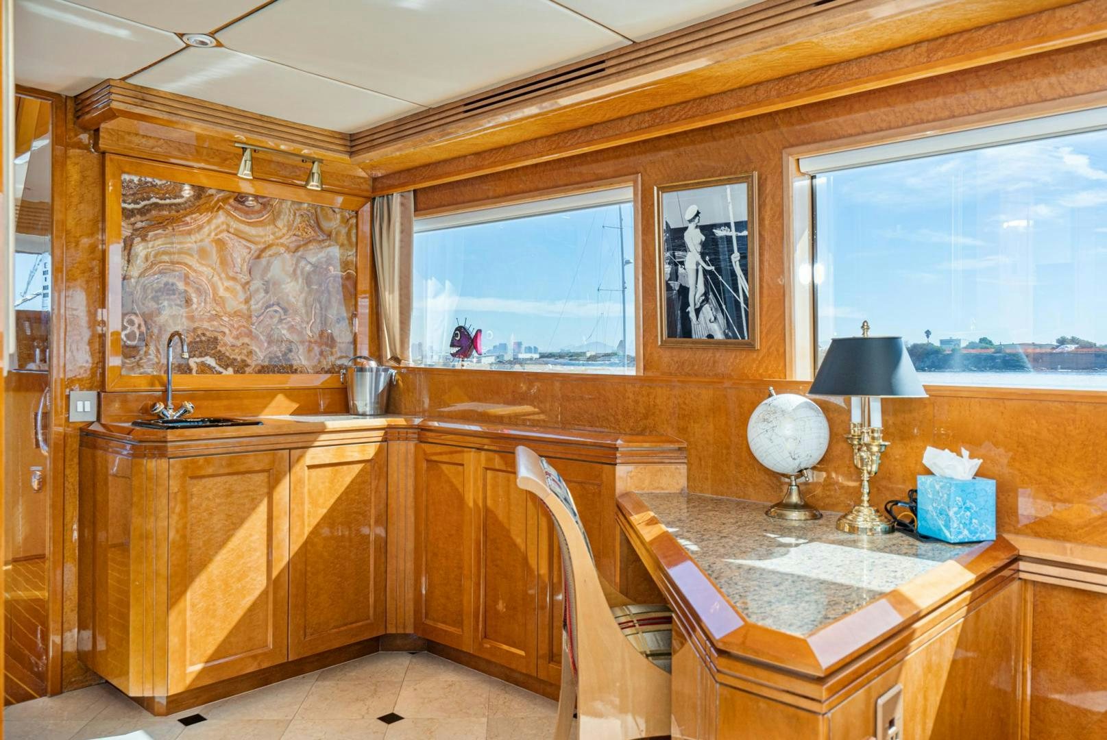 a kitchen with wooden cabinets aboard LOVELIEST LADY Yacht for Sale