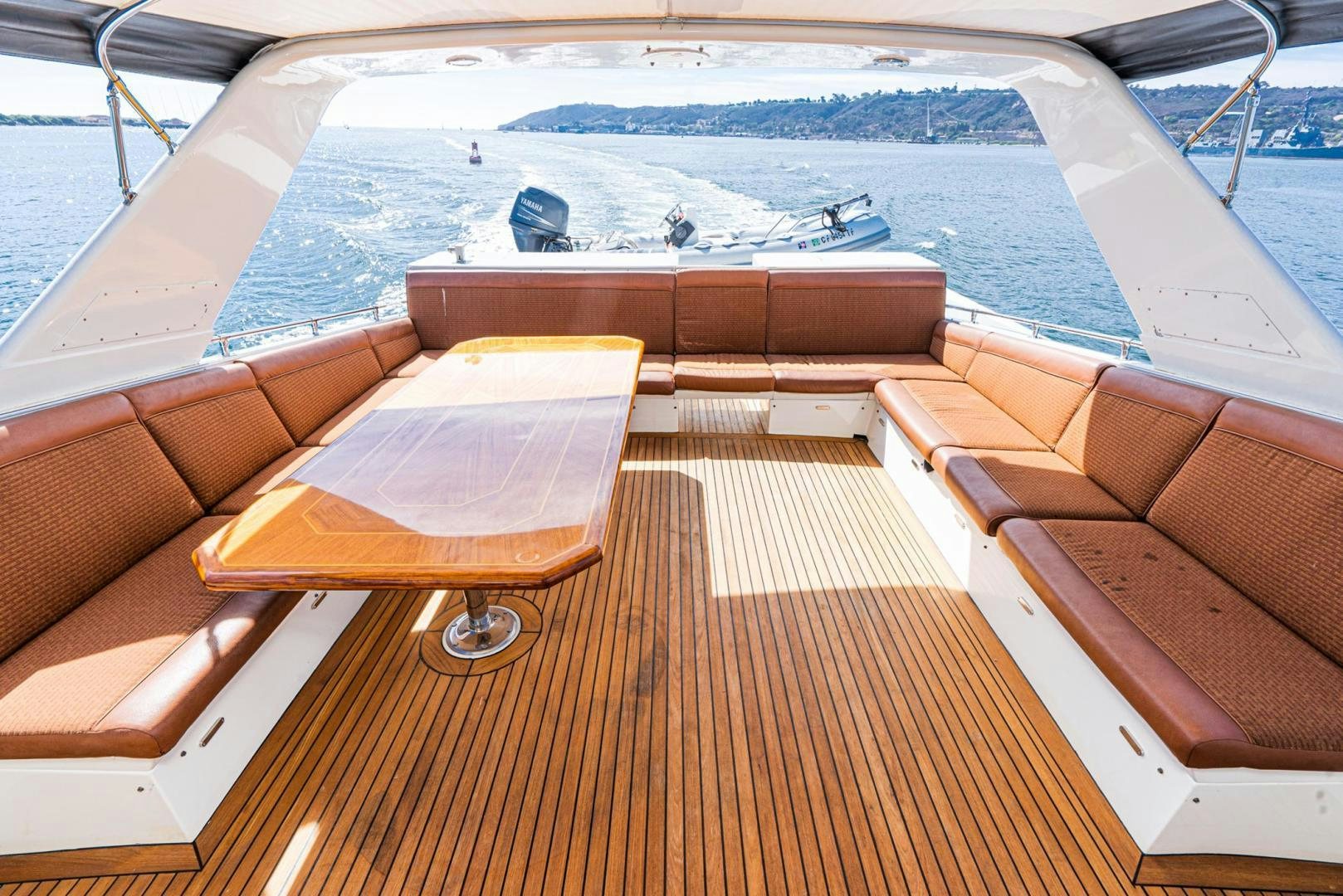 a deck with a deck and a boat on it aboard LOVELIEST LADY Yacht for Sale