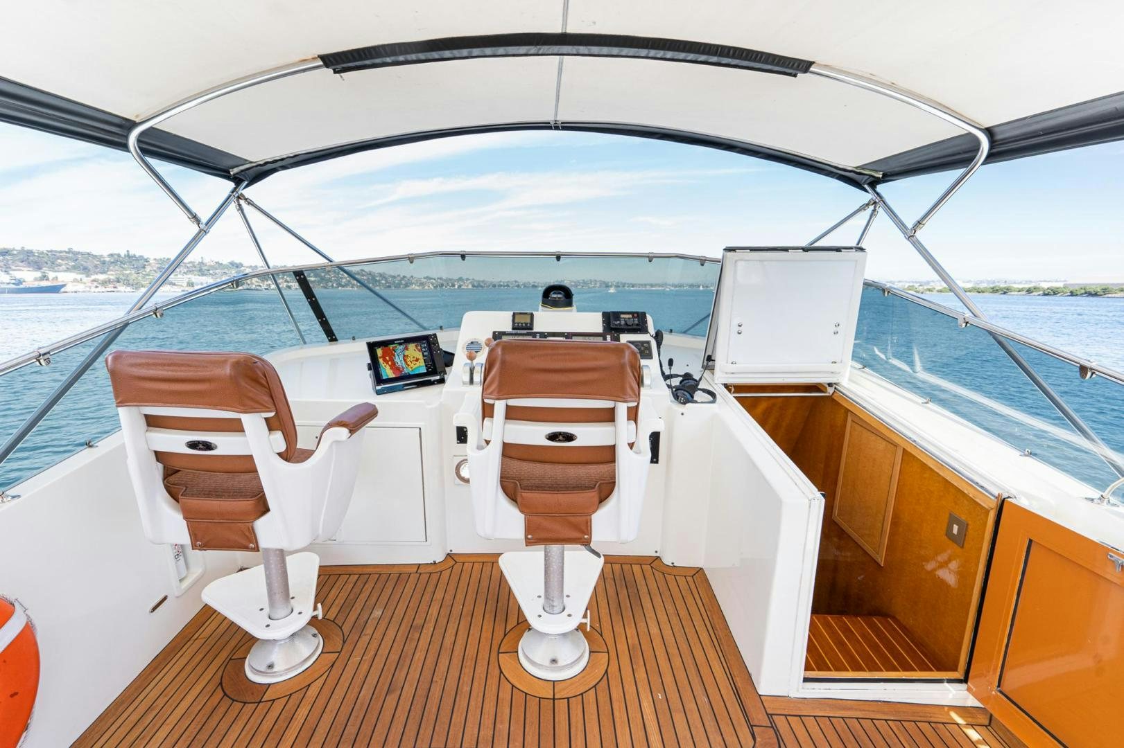 a boat with a seat and a seat on the deck aboard LOVELIEST LADY Yacht for Sale