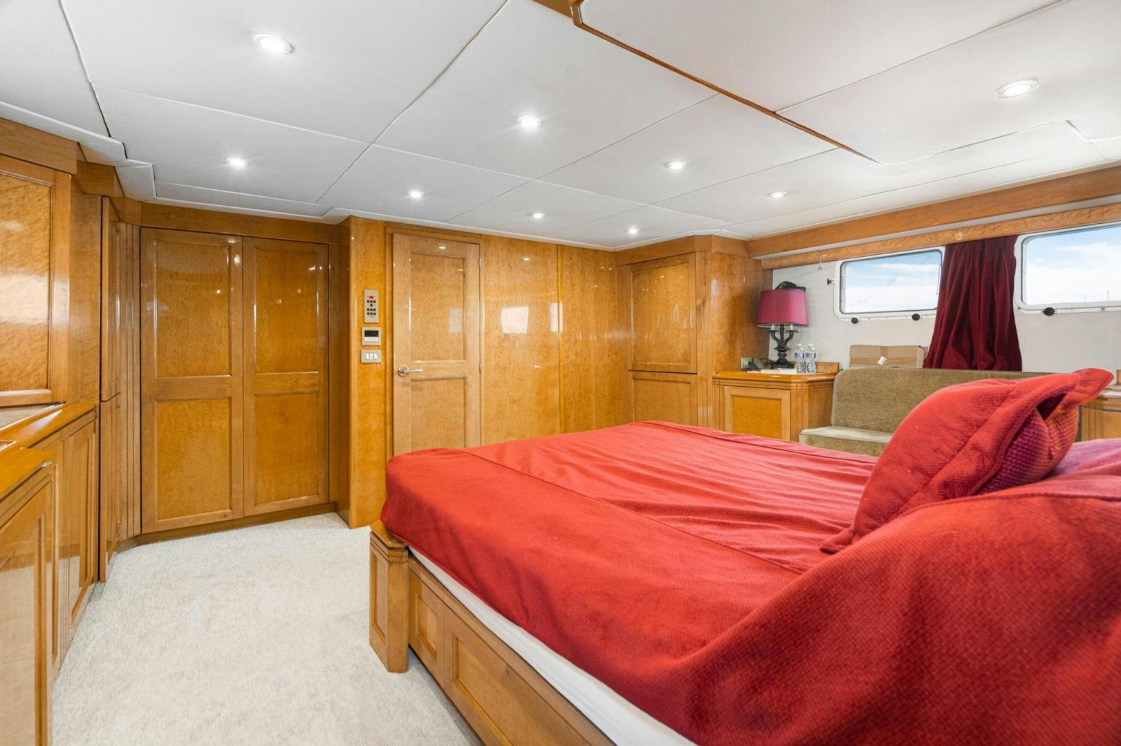 a bedroom with a bed and a desk aboard LOVELIEST LADY Yacht for Sale
