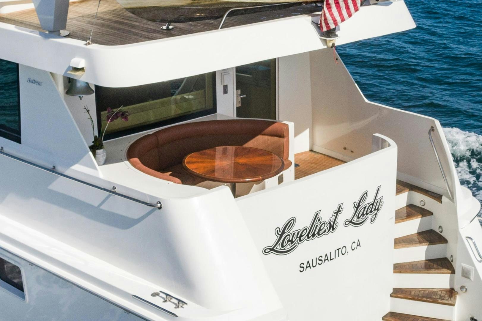 a boat with a bench on the deck aboard LOVELIEST LADY Yacht for Sale