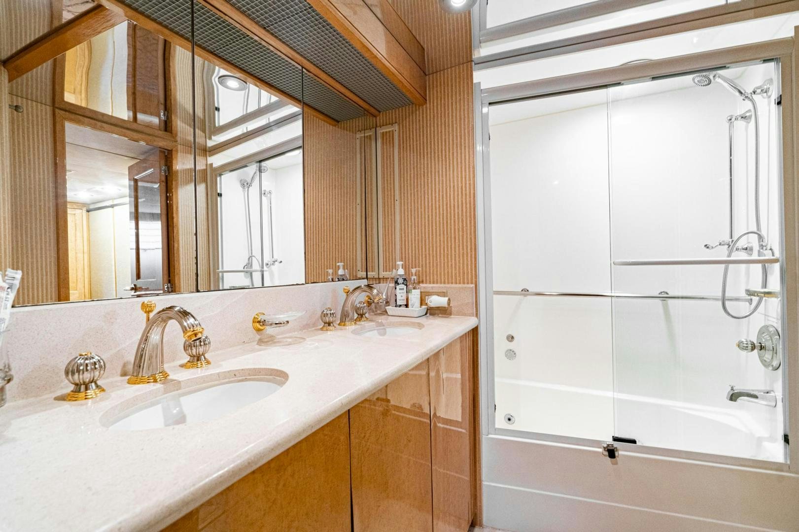 a bathroom with a sink and a mirror aboard LOVELIEST LADY Yacht for Sale