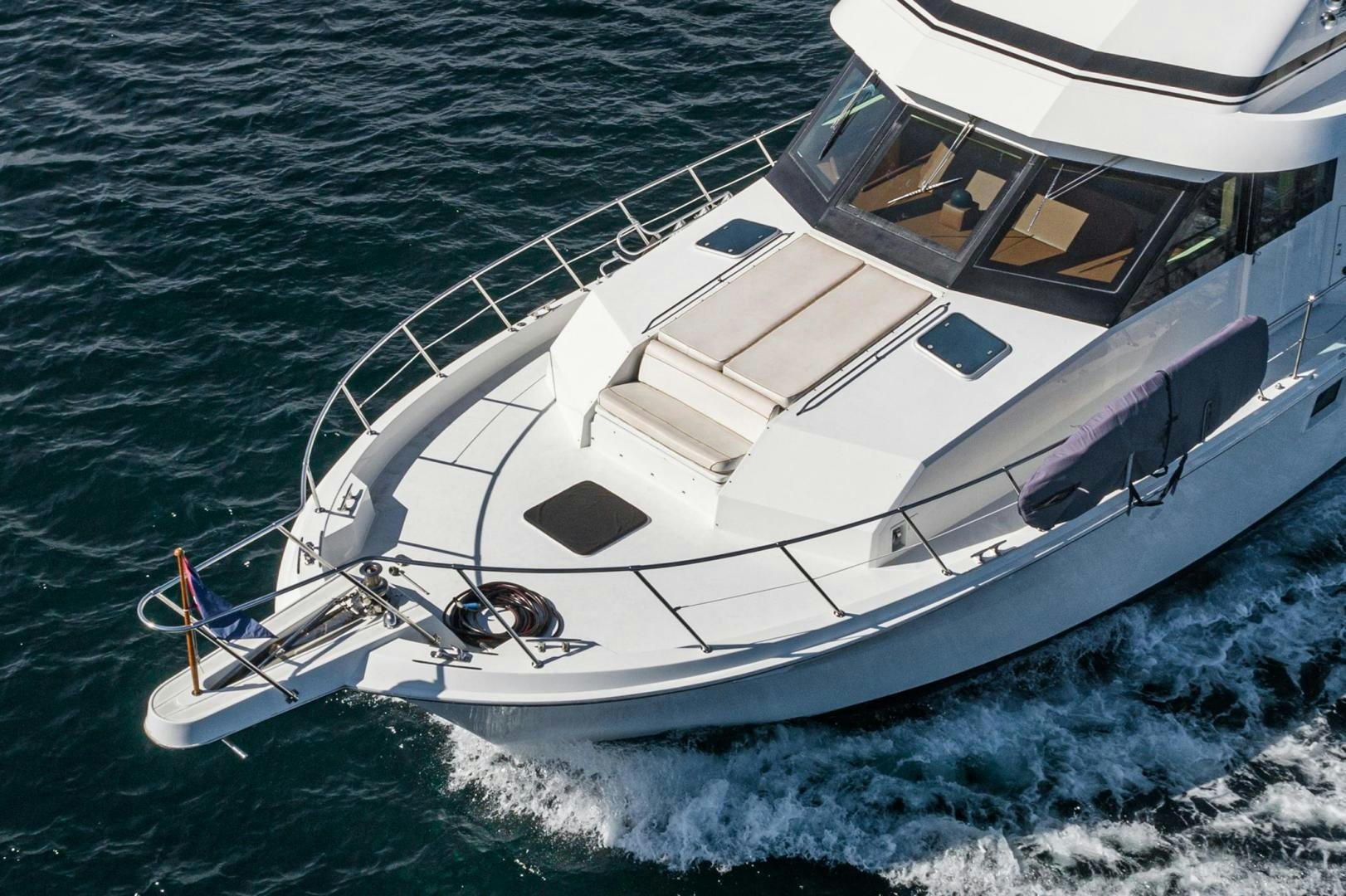 a white boat on the water aboard LOVELIEST LADY Yacht for Sale