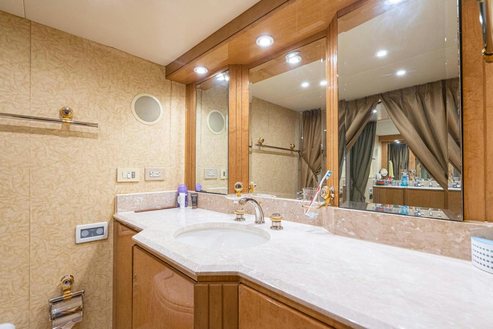 a bathroom with a large mirror aboard LOVELIEST LADY Yacht for Sale