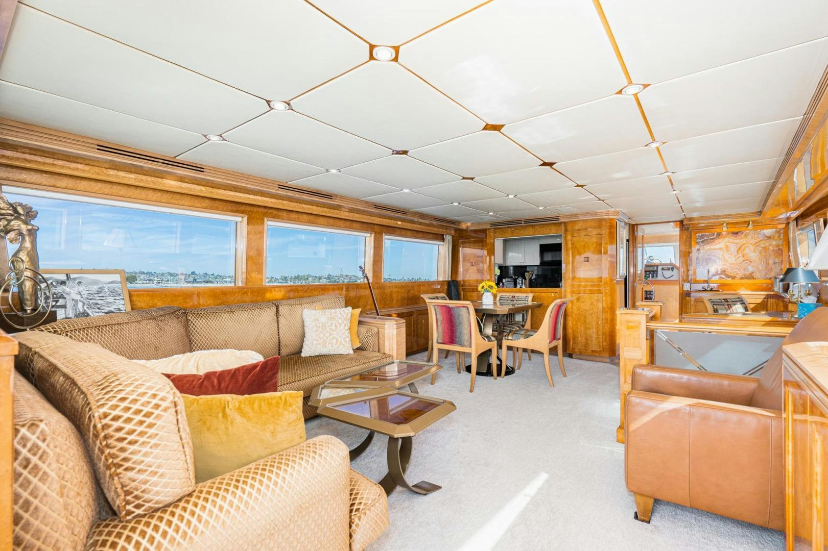 a living room with couches and chairs aboard LOVELIEST LADY Yacht for Sale