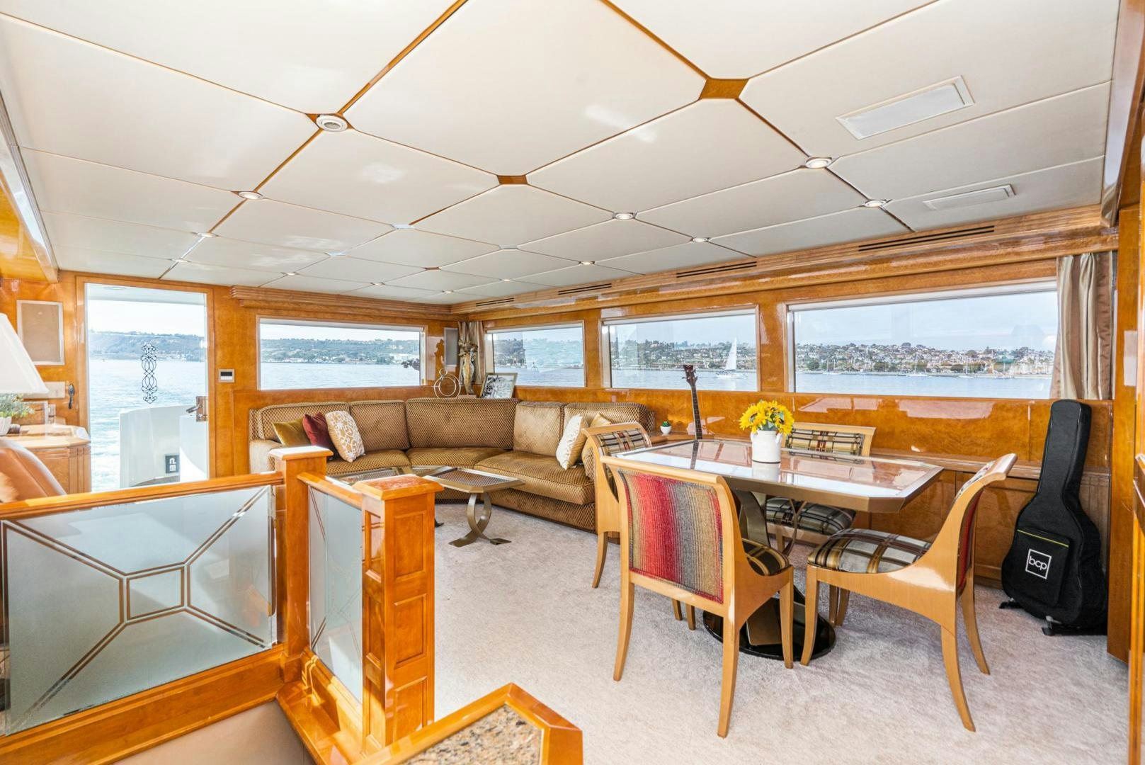 a living room with a table and chairs aboard LOVELIEST LADY Yacht for Sale
