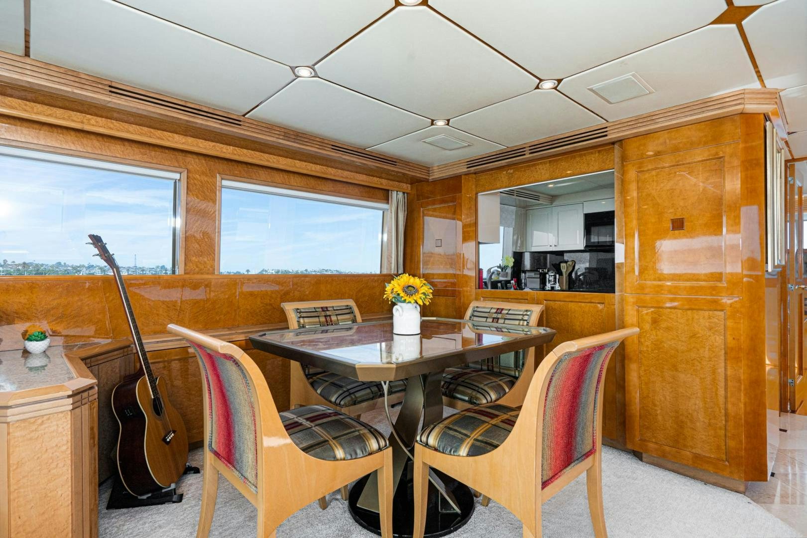 a room with a table and chairs aboard LOVELIEST LADY Yacht for Sale