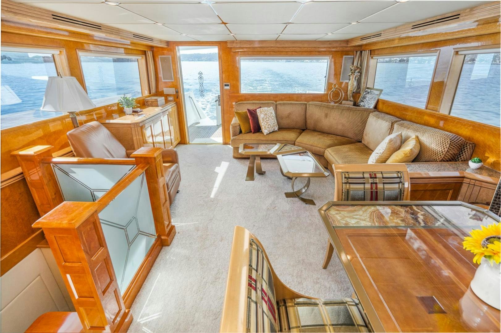 a living room with a couch and a table aboard LOVELIEST LADY Yacht for Sale