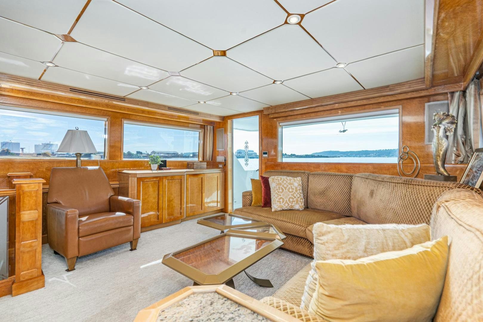 a living room with a couch and a coffee table aboard LOVELIEST LADY Yacht for Sale