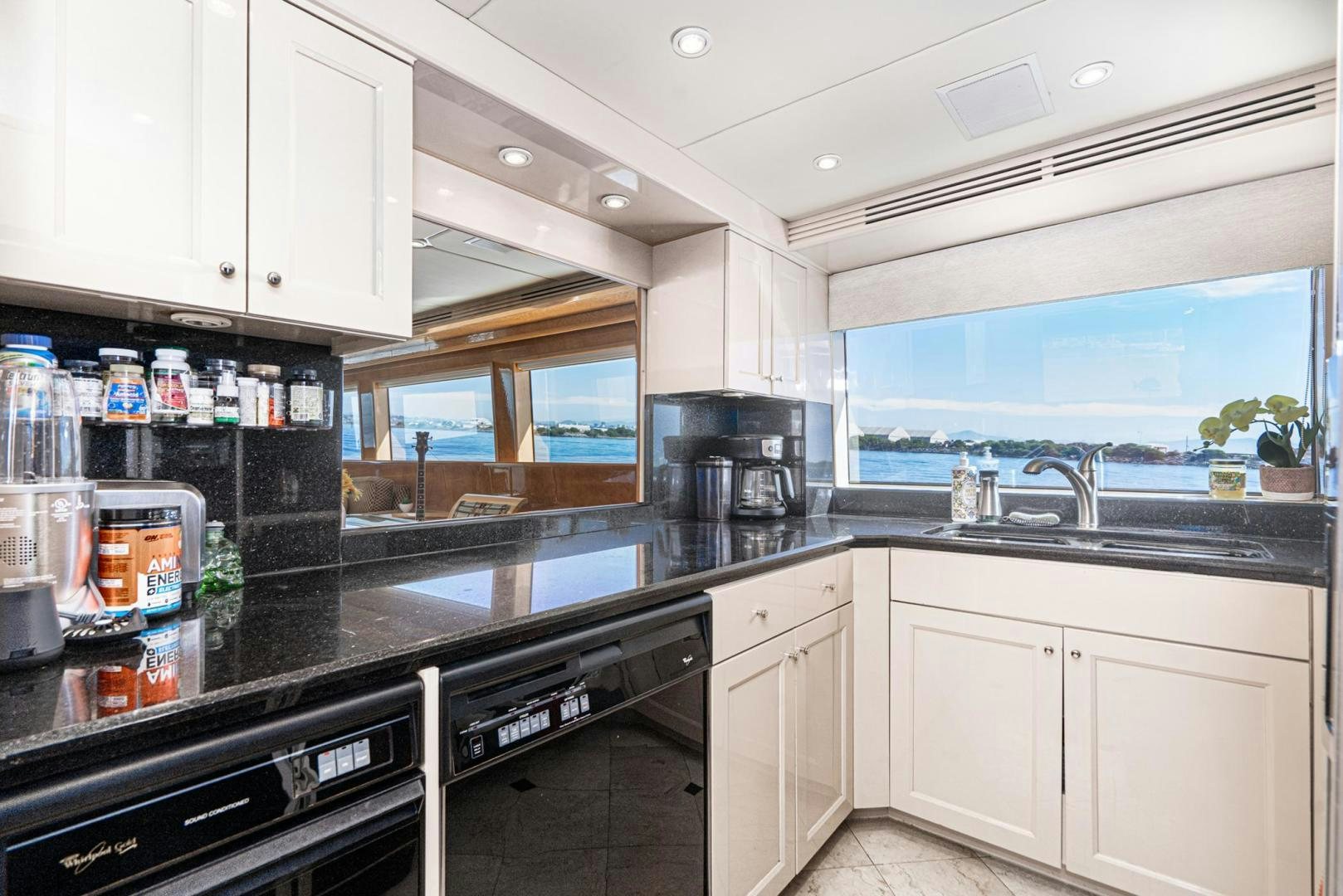 a kitchen with a lot of counter tops and cabinets aboard LOVELIEST LADY Yacht for Sale