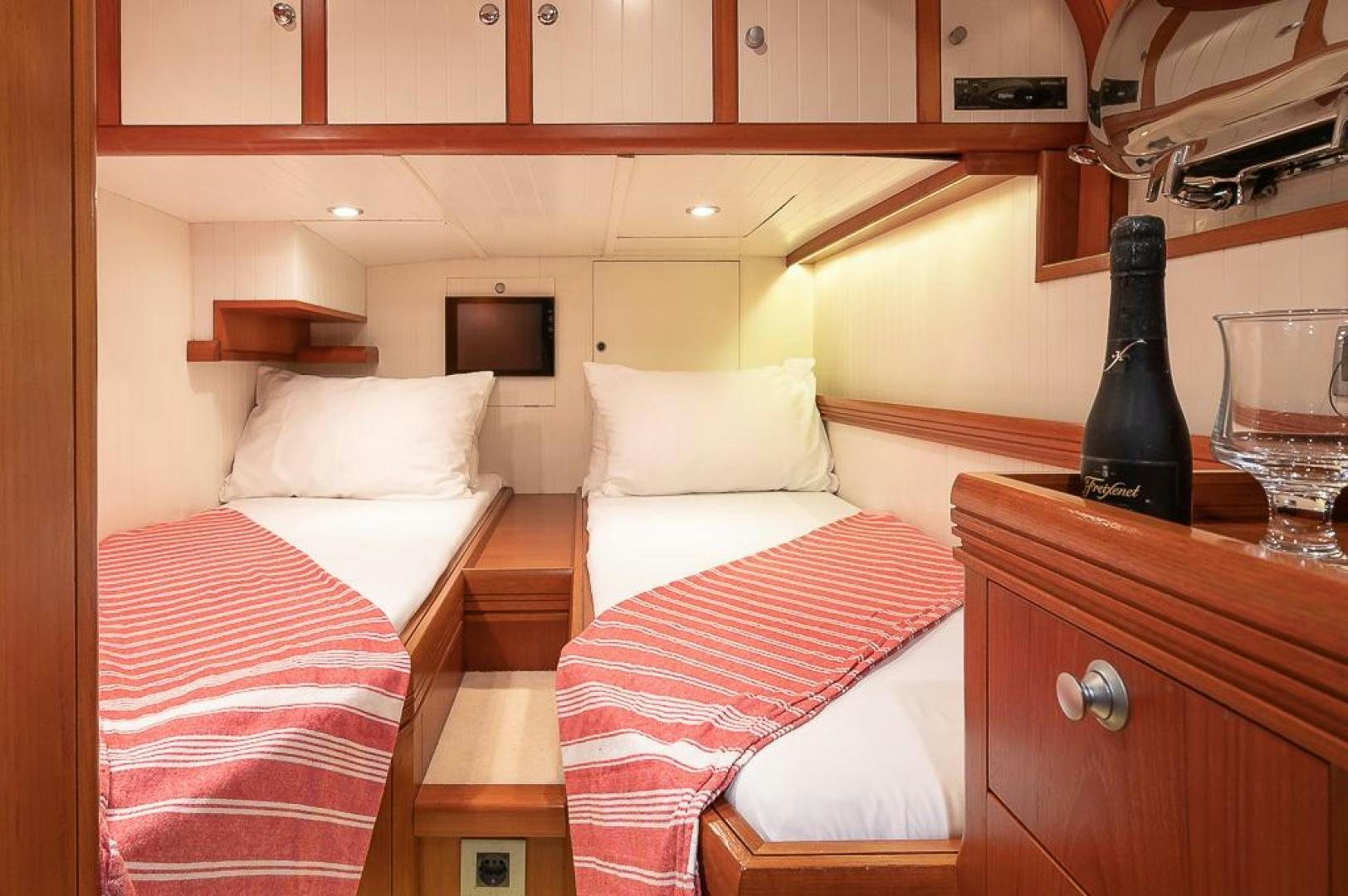 a room with two beds aboard CAPELLA Yacht for Sale