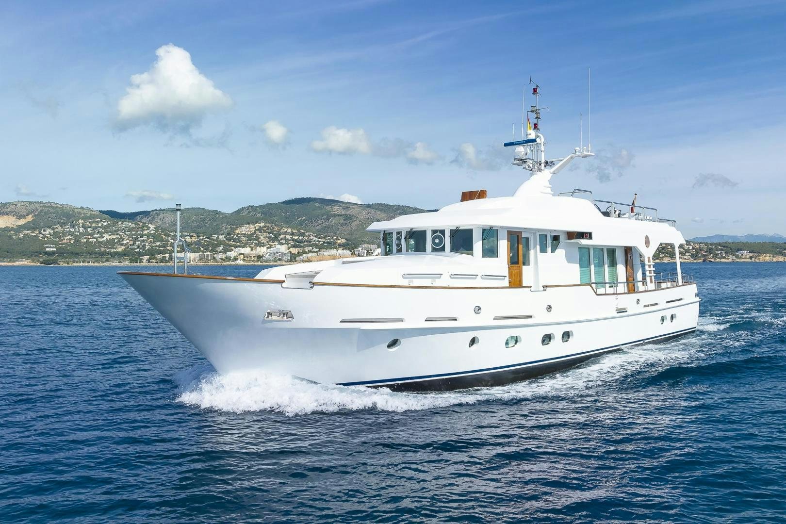 a white boat on the water aboard CAPELLA Yacht for Sale