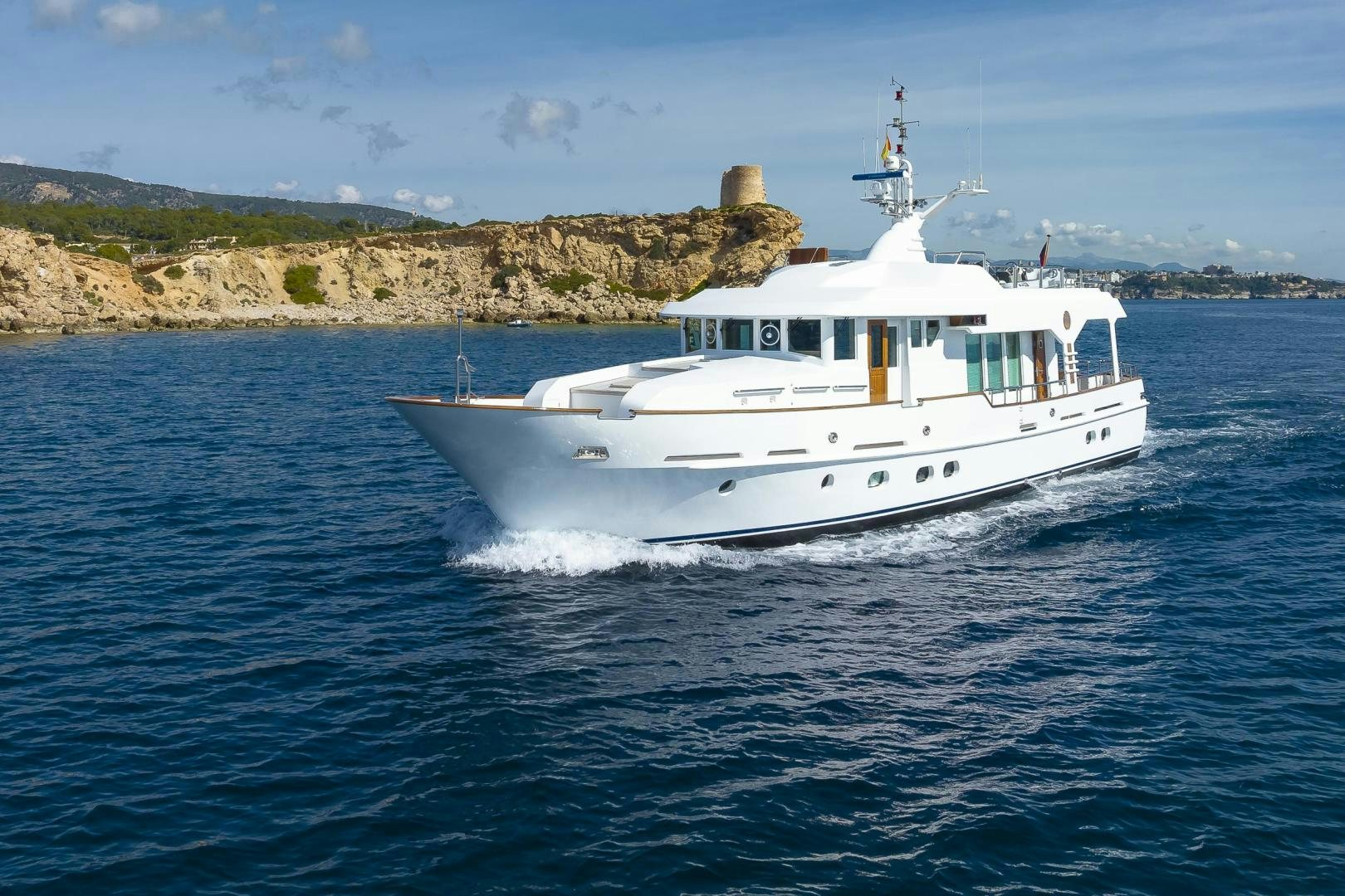 a white boat on the water aboard CAPELLA Yacht for Sale