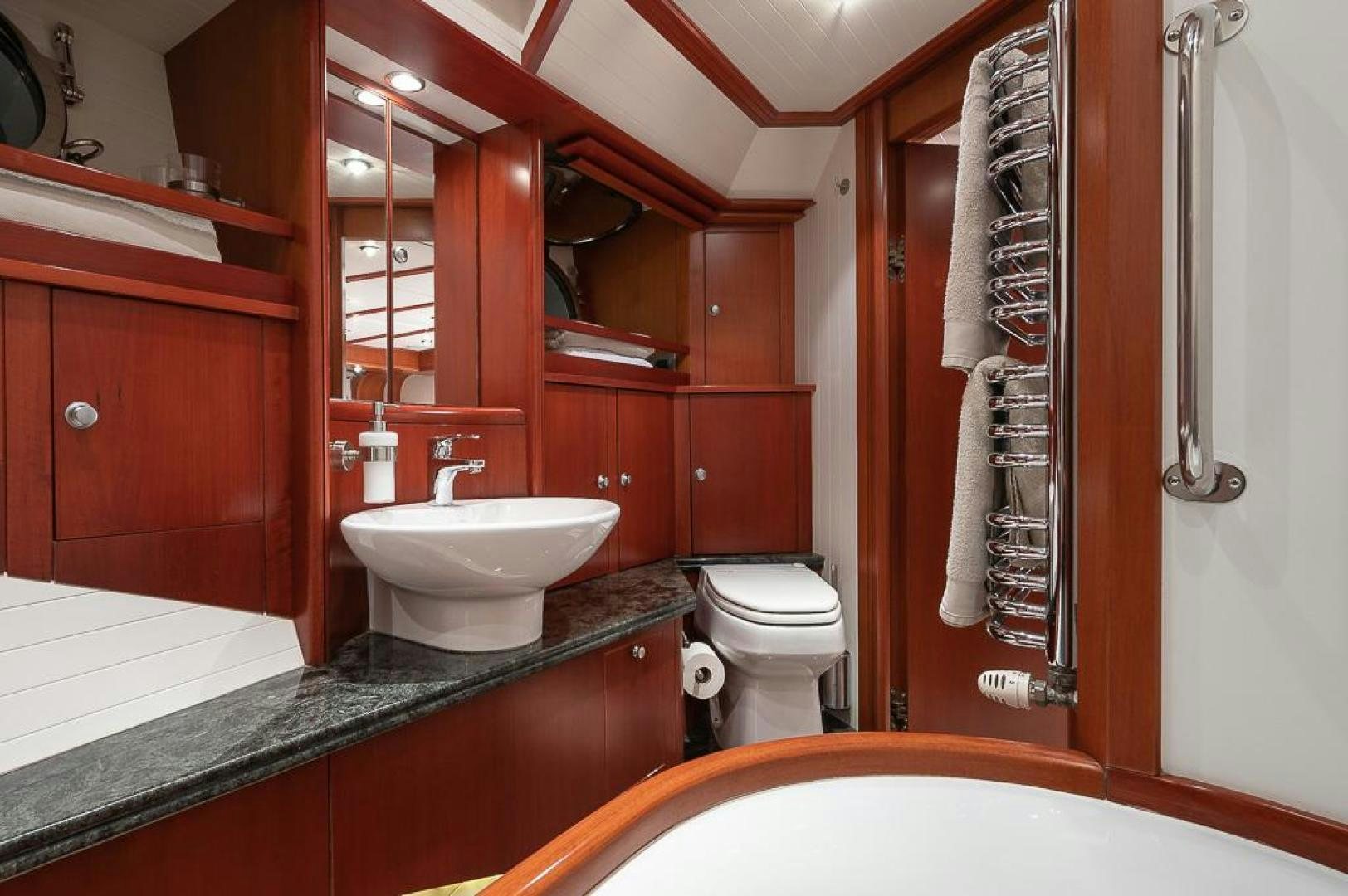 a bathroom with a sink and a toilet aboard CAPELLA Yacht for Sale