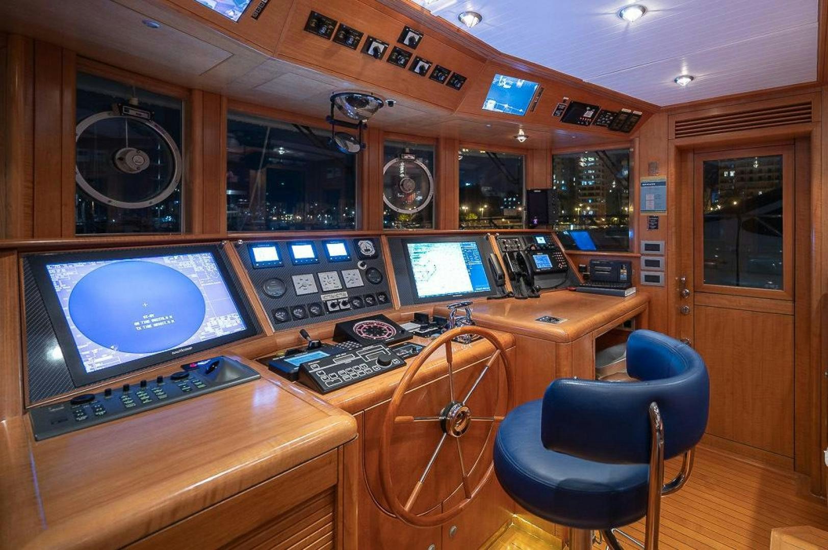 a control room with a couple of monitors and a game console aboard CAPELLA Yacht for Sale