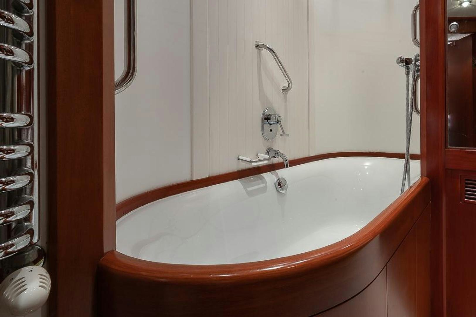 a bathtub with a wooden handle aboard CAPELLA Yacht for Sale