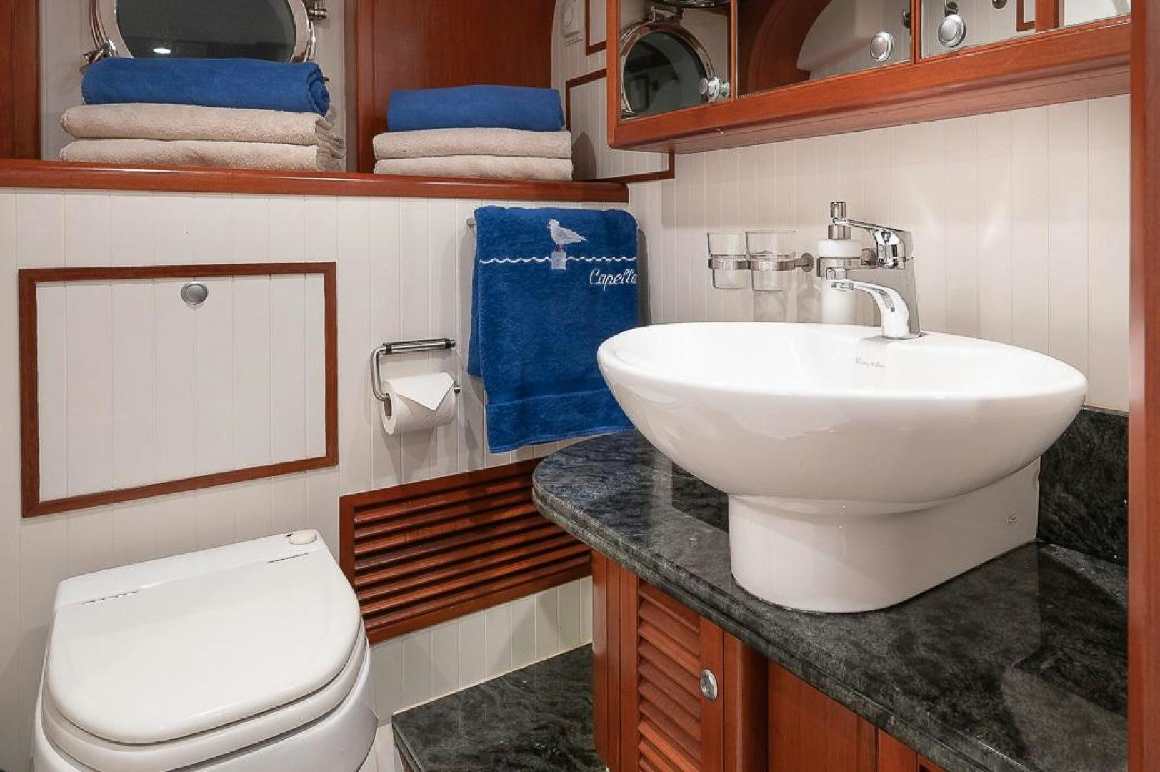 a bathroom with a sink and toilet aboard CAPELLA Yacht for Sale