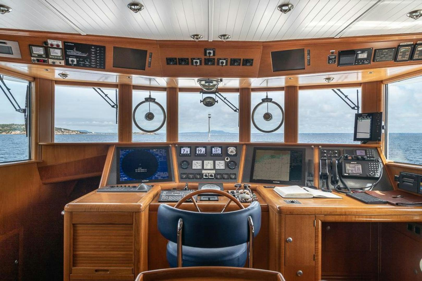 a control room with a few monitors aboard CAPELLA Yacht for Sale