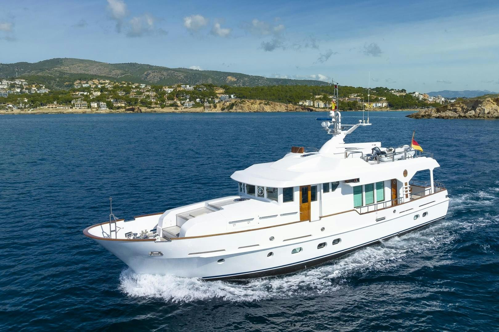 a white boat on the water aboard CAPELLA Yacht for Sale