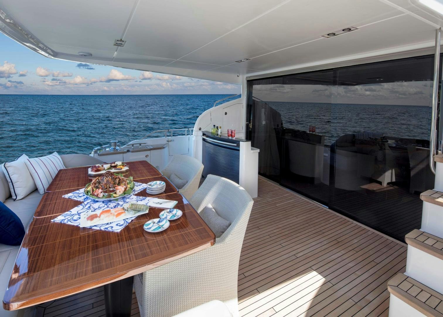 a table with food on it aboard HOT PURSUIT Yacht for Sale