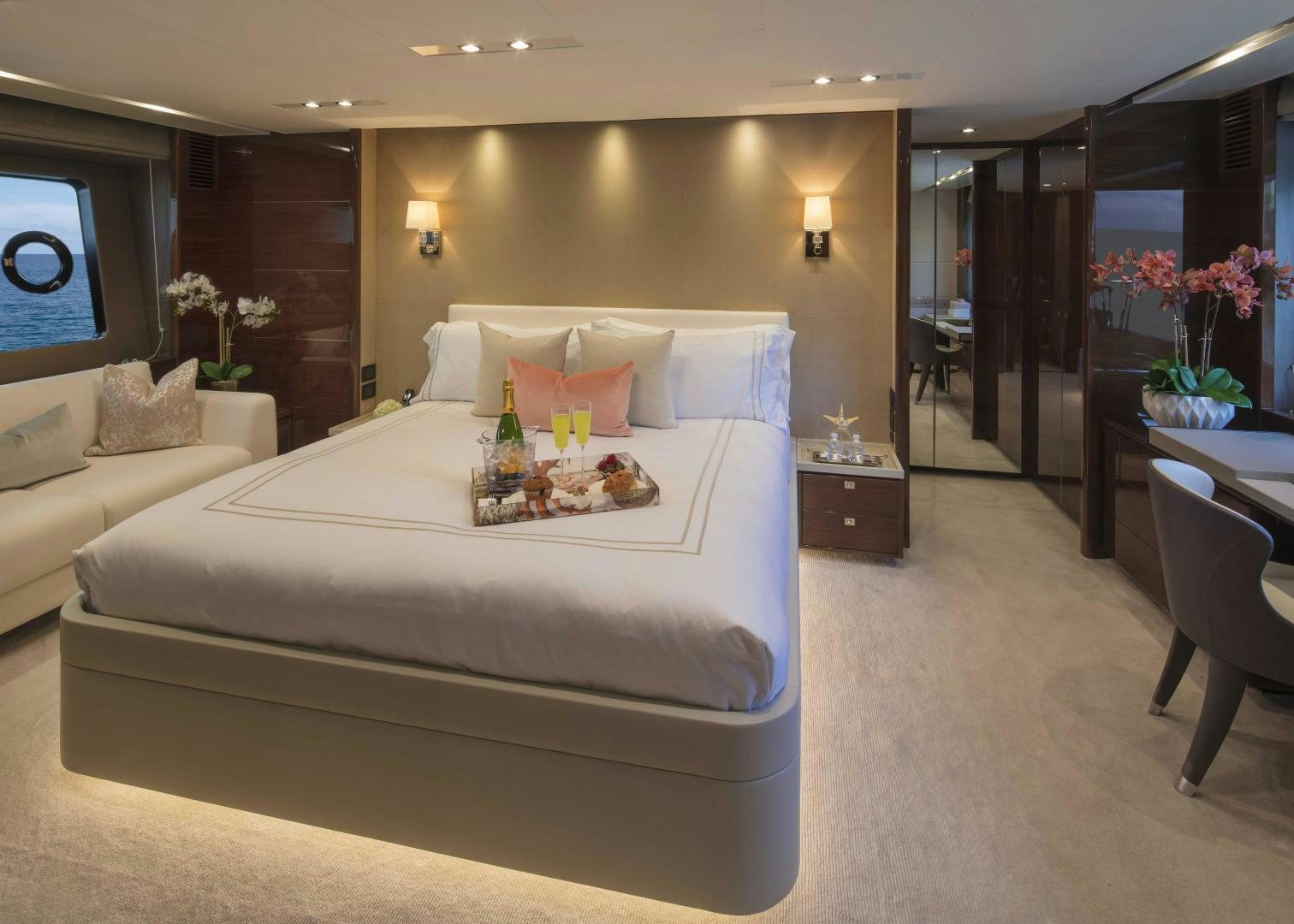 a large bed in a hotel room aboard HOT PURSUIT Yacht for Sale