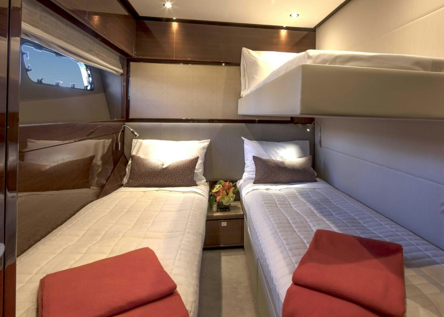 a room with two beds aboard HOT PURSUIT Yacht for Sale