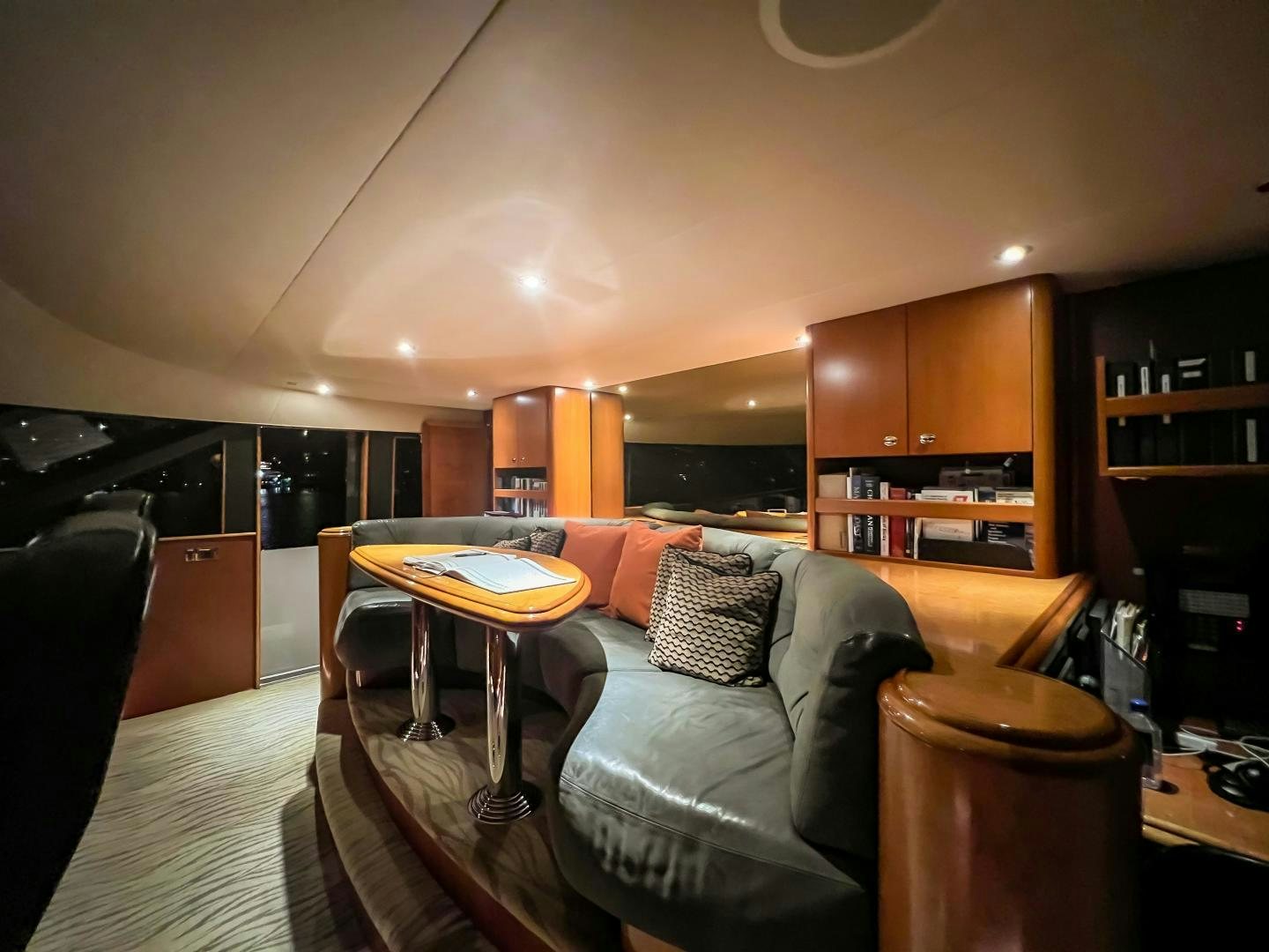 a living room with a couch and a table aboard SERENGETI Yacht for Sale
