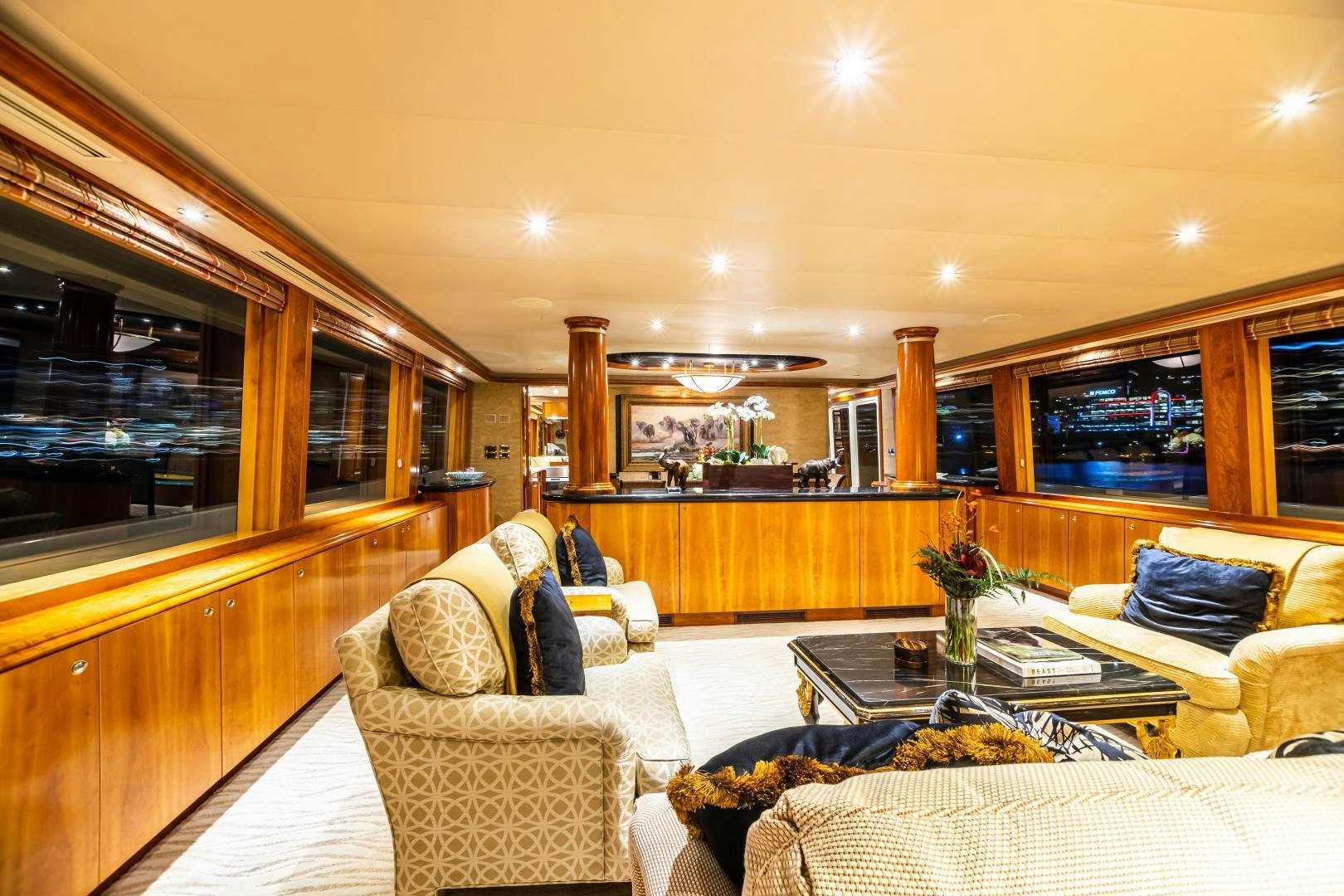 a living room with a couch and a coffee table aboard SERENGETI Yacht for Sale