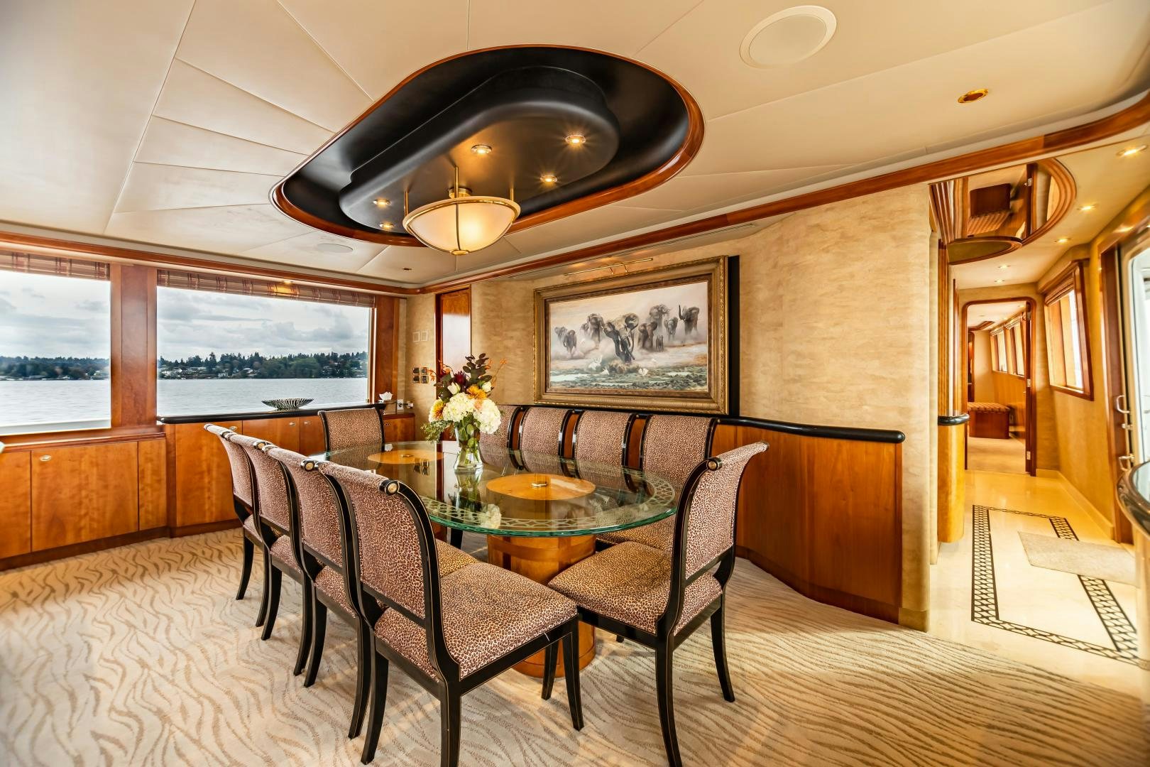 a dining room with a table and chairs aboard SERENGETI Yacht for Sale
