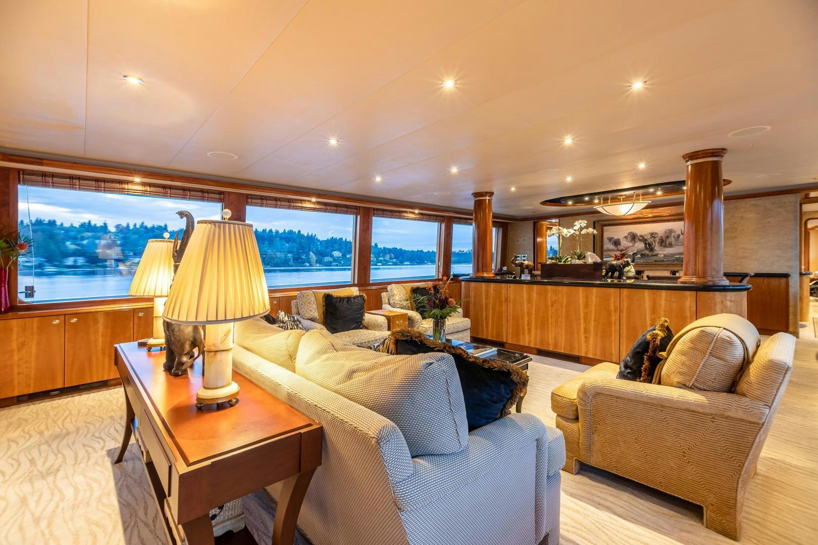a living room with a couch and a table aboard SERENGETI Yacht for Sale