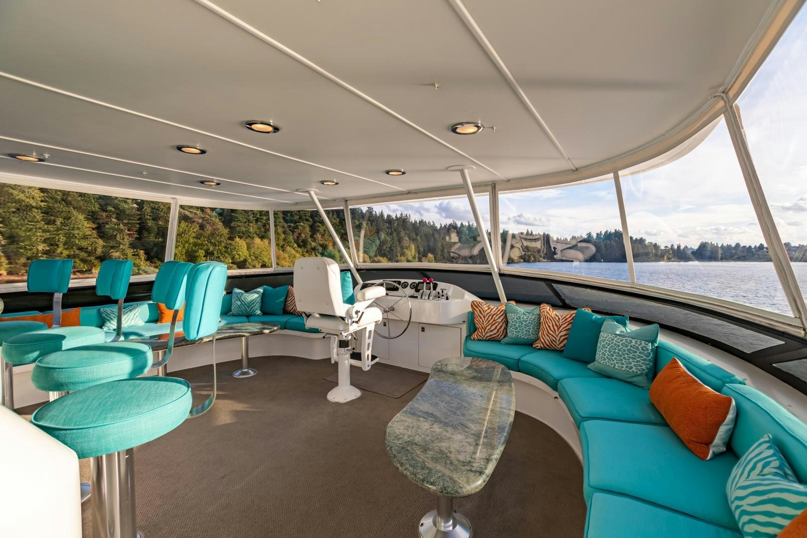 a tent with a couch and chairs aboard SERENGETI Yacht for Sale
