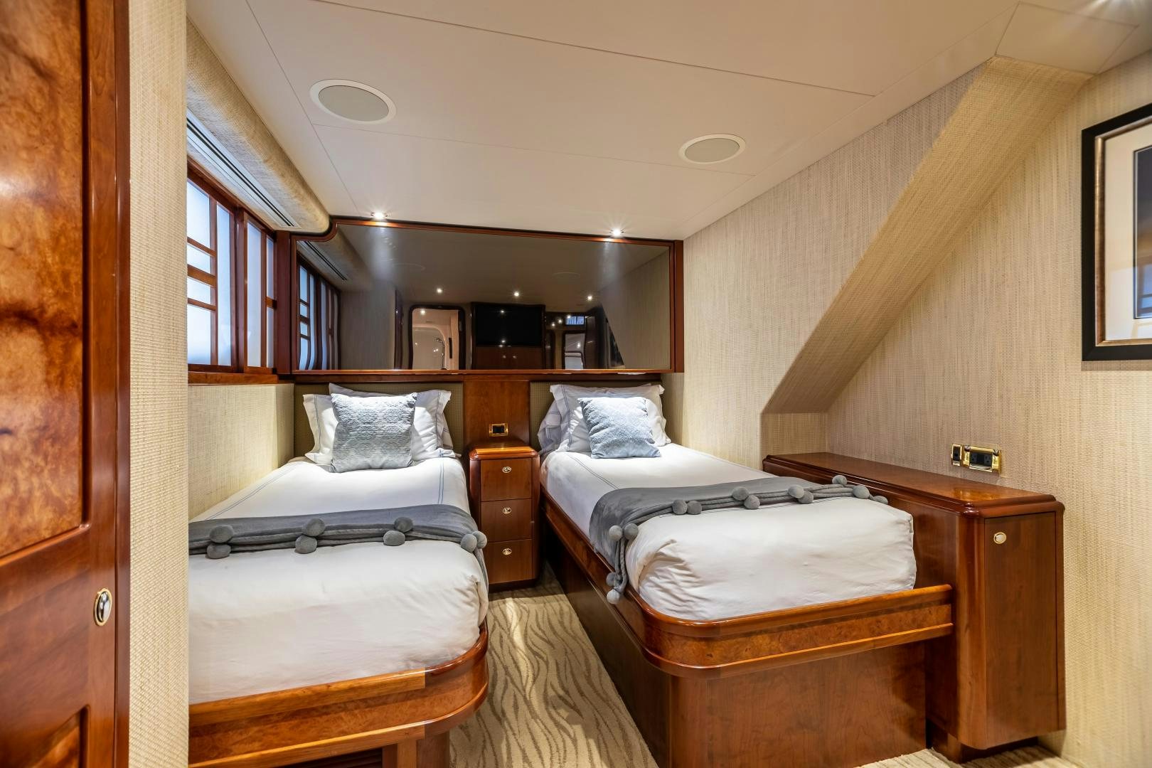 a room with two beds aboard SERENGETI Yacht for Sale