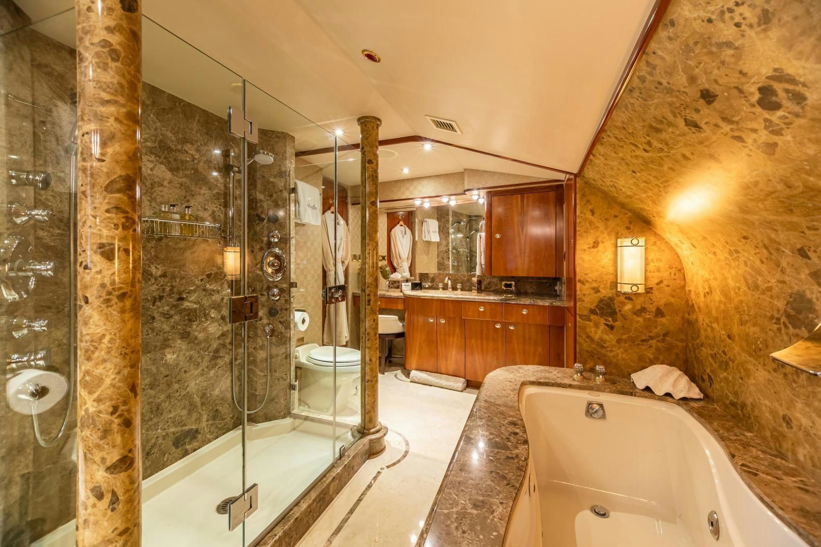 a bathroom with a large glass shower aboard SERENGETI Yacht for Sale