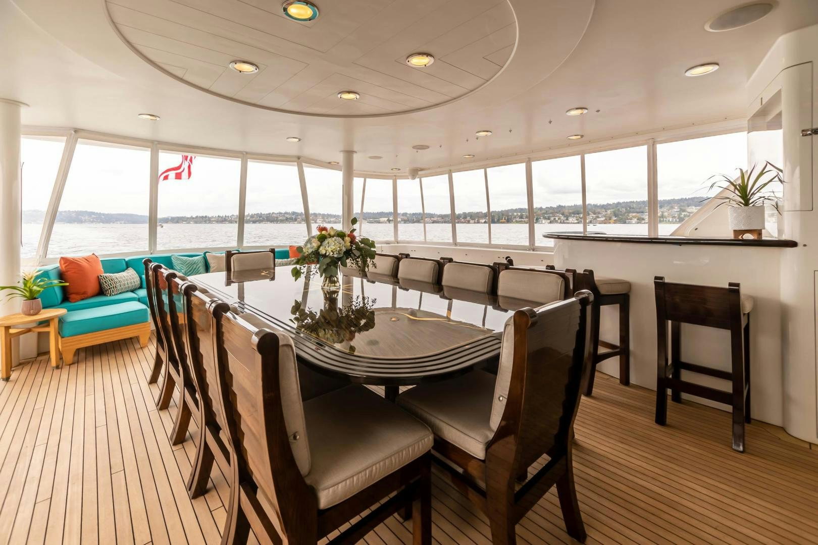 a large room with a table and chairs aboard SERENGETI Yacht for Sale