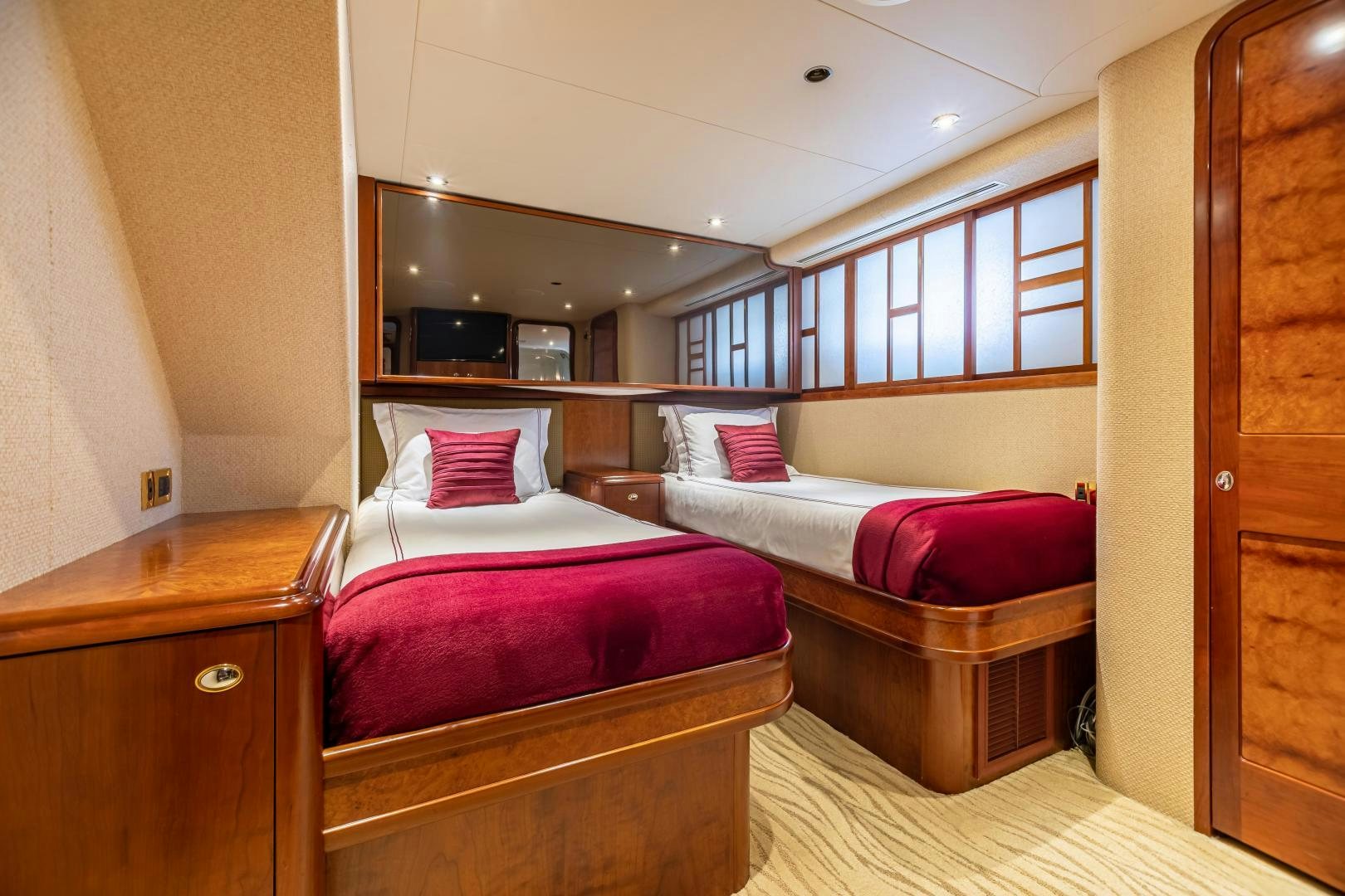 a room with two beds aboard SERENGETI Yacht for Sale