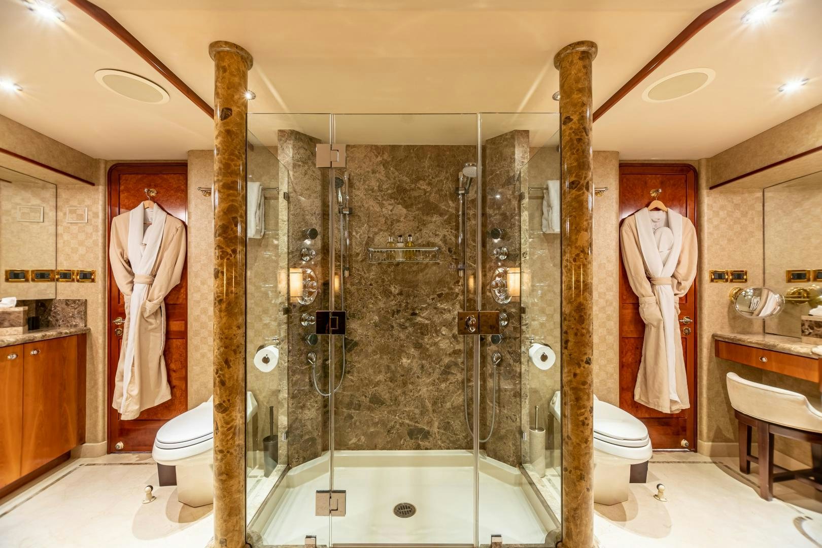 a bathroom with a glass shower aboard SERENGETI Yacht for Sale