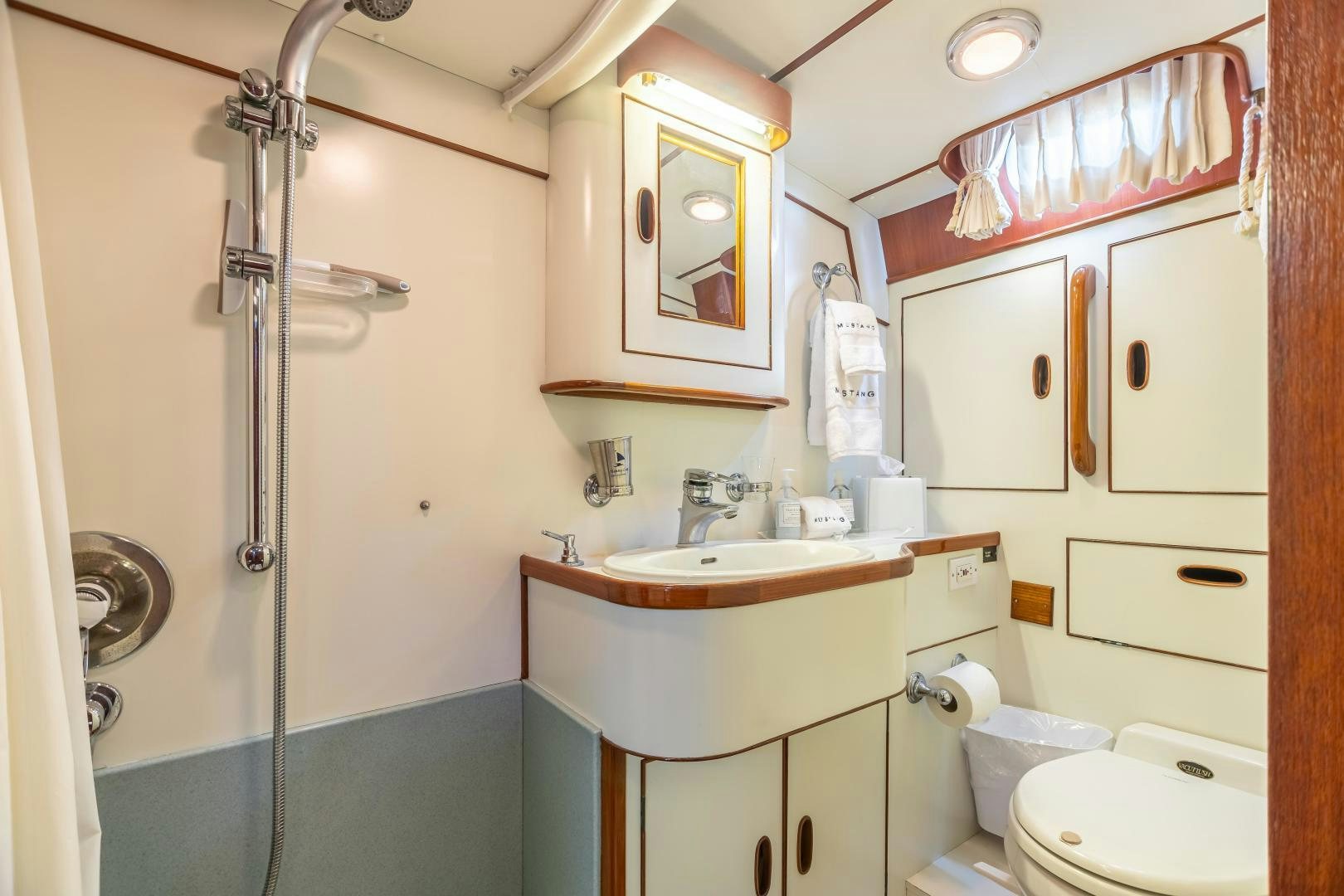 a bathroom with a shower unit and sink aboard MUSTANG Yacht for Sale