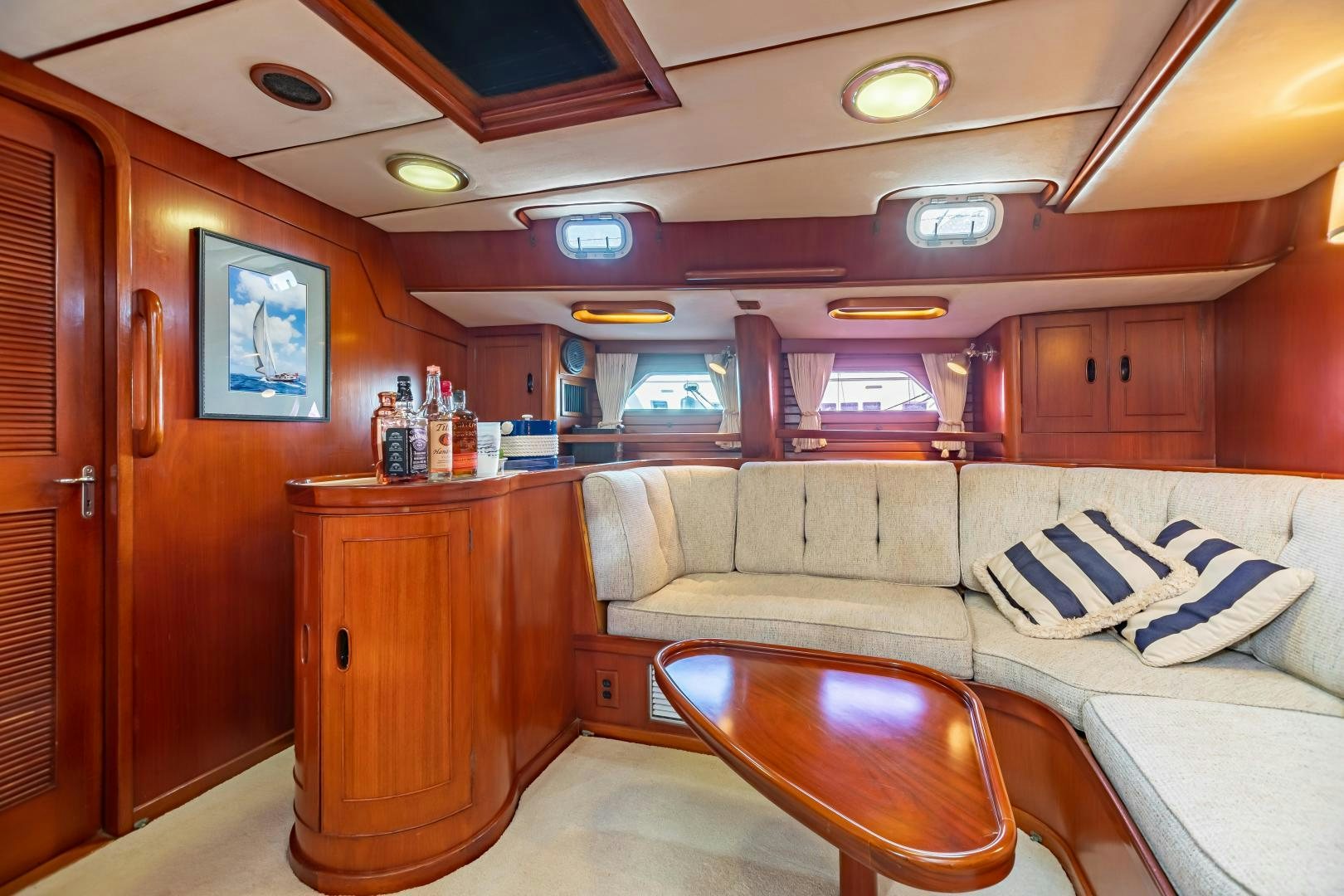 a living room with a couch and a table aboard MUSTANG Yacht for Sale